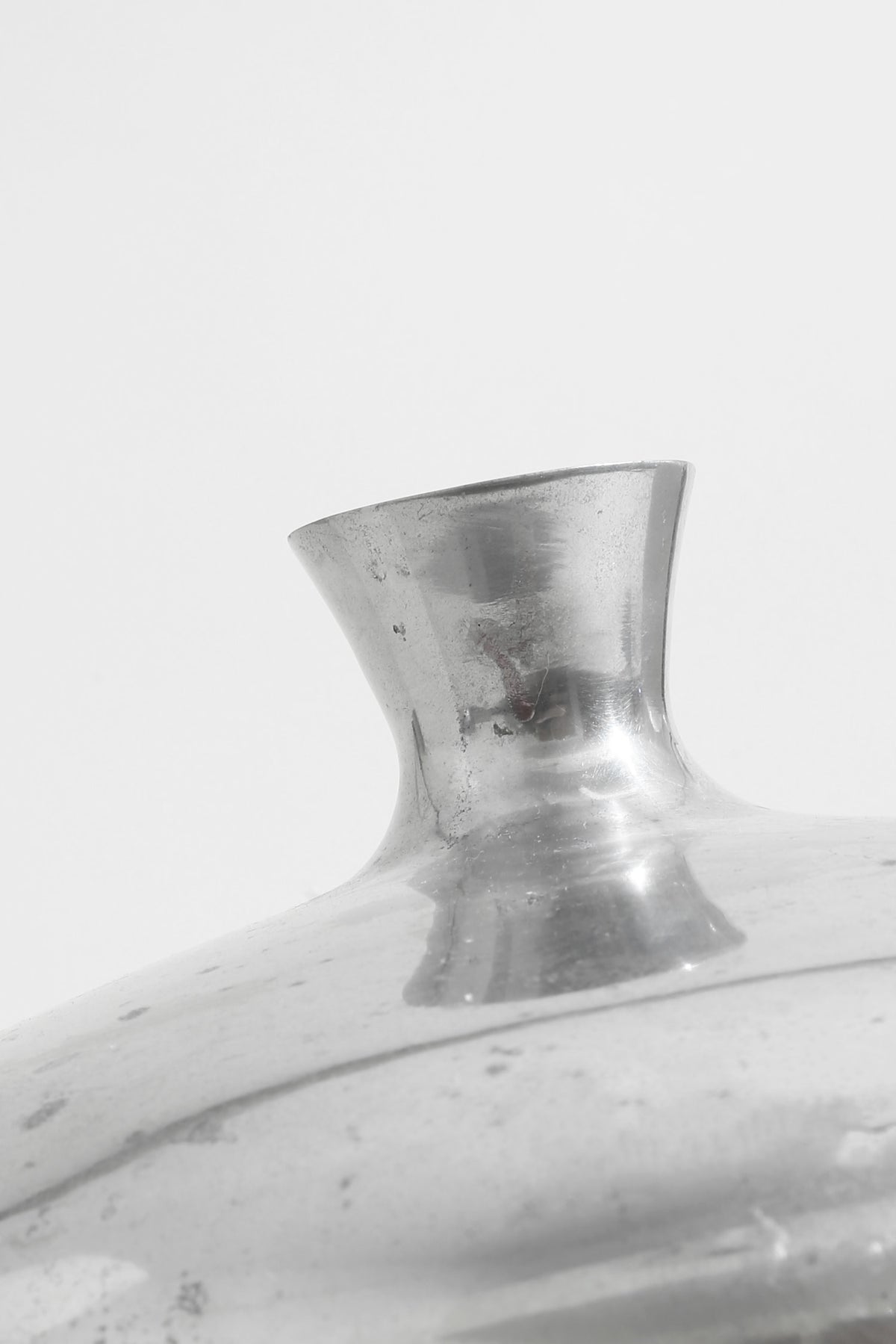 Form Sculpture Vase — close-up of reflective silver surface