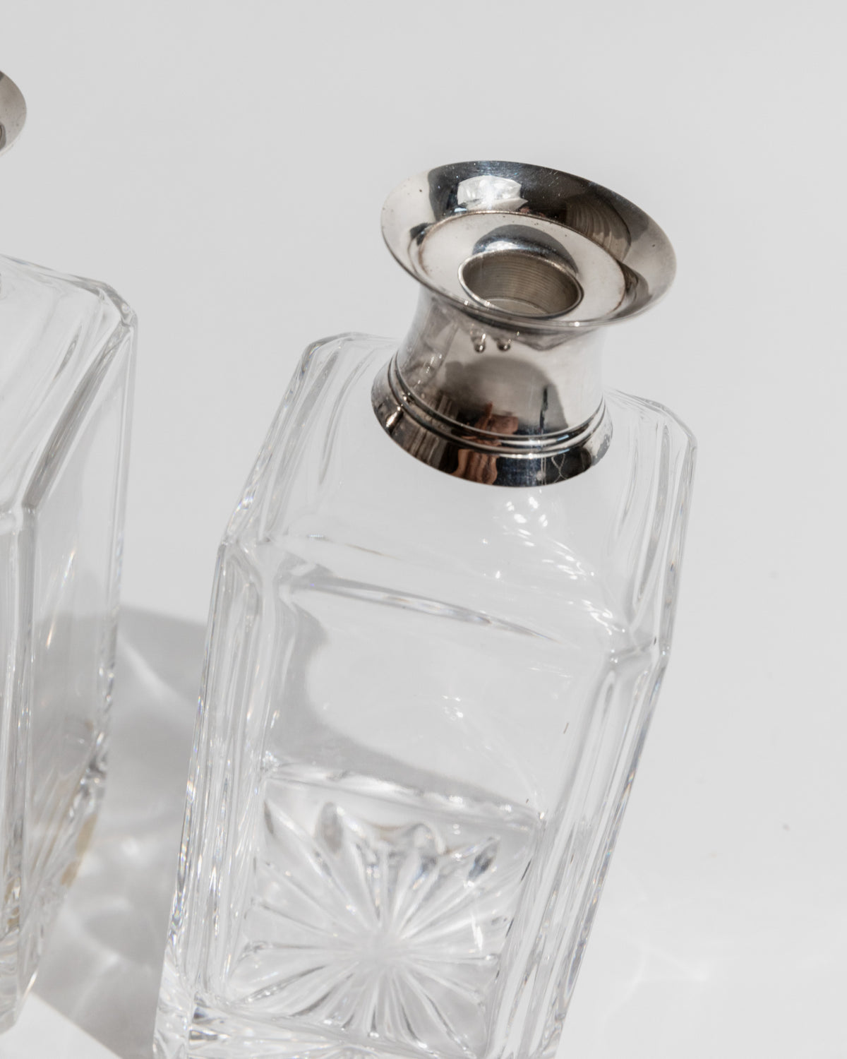 Crystal decanter stopper detail with silver-plated funnel top