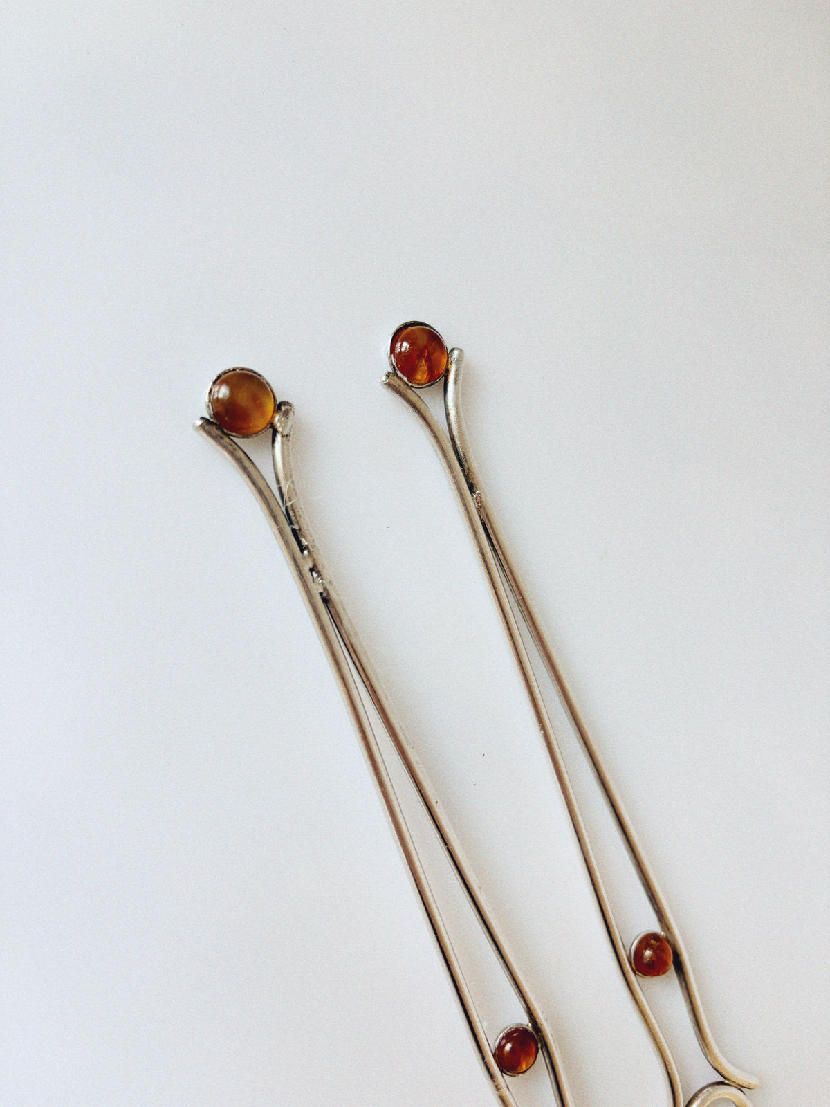 Silver Plated Serving Forks With Amber Inlay, Poland — close-up view highlighting amber inlays