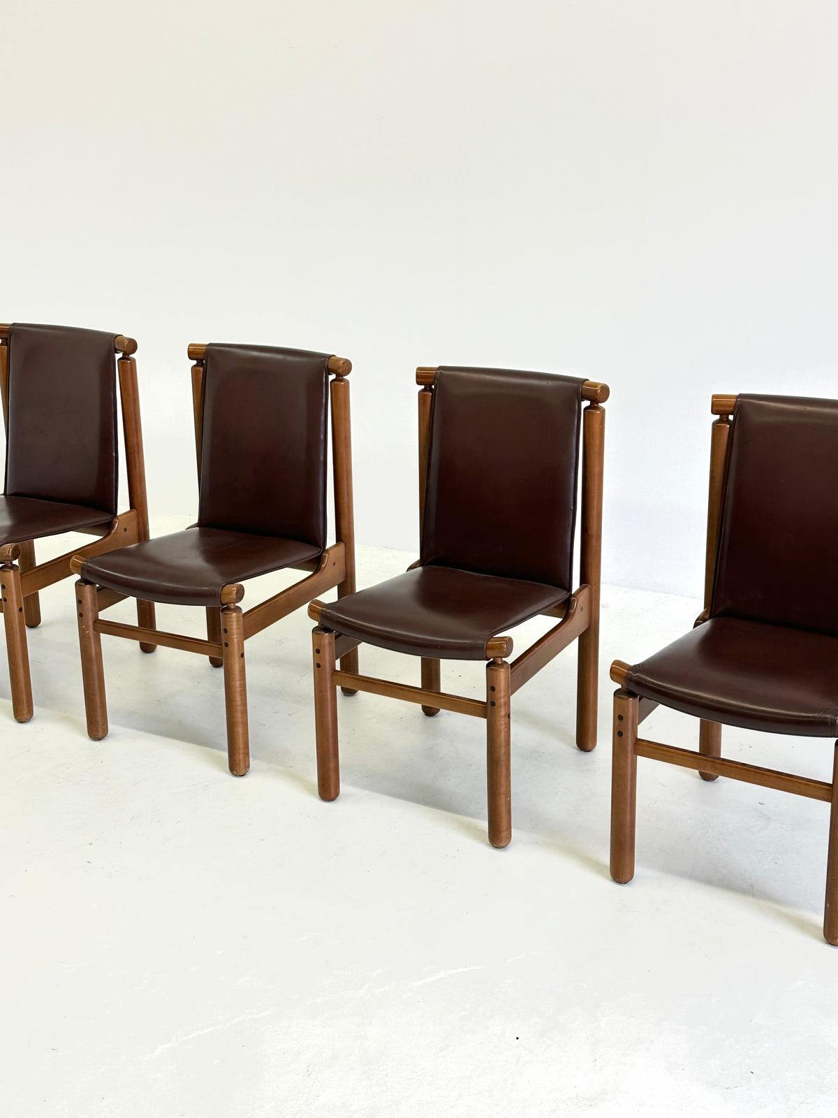 Set of Tapiovaara dining chairs by La Permanente Cantù — side angle