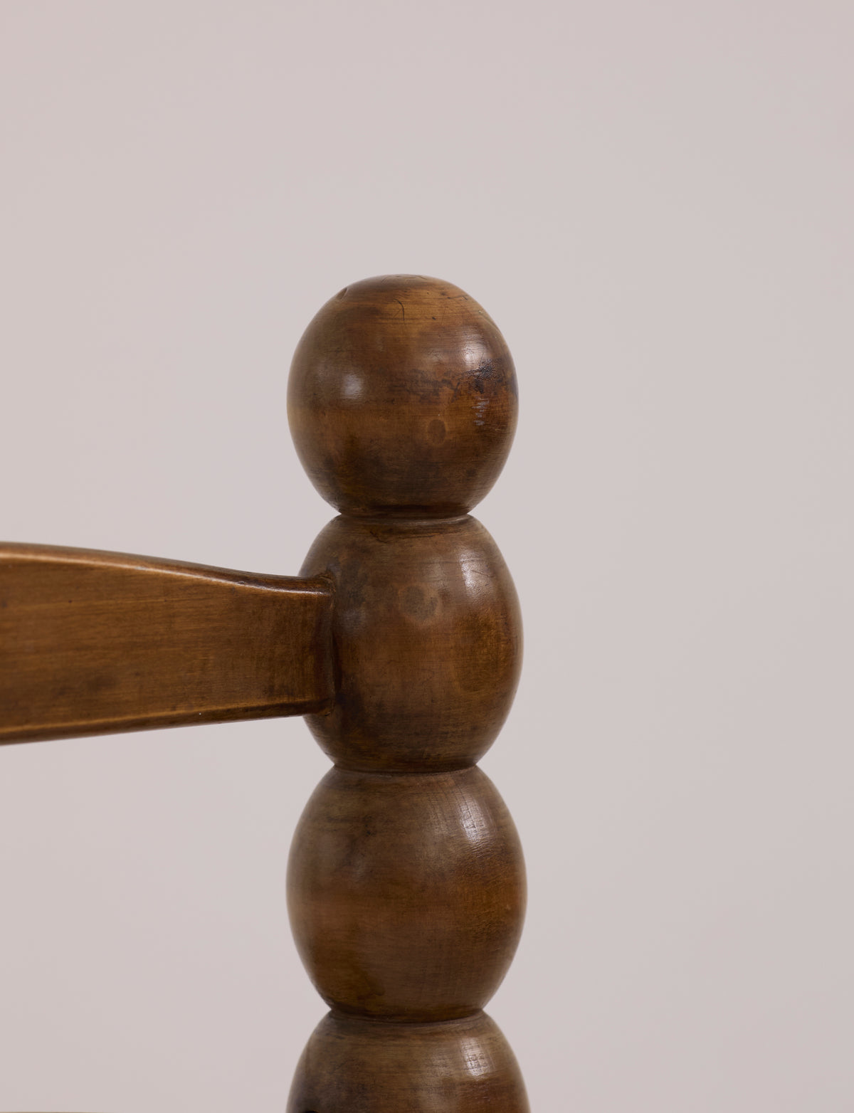 Vintage French Oak Wood and Straw Low Chair C. 1940 — close-up of rounded wooden backrest