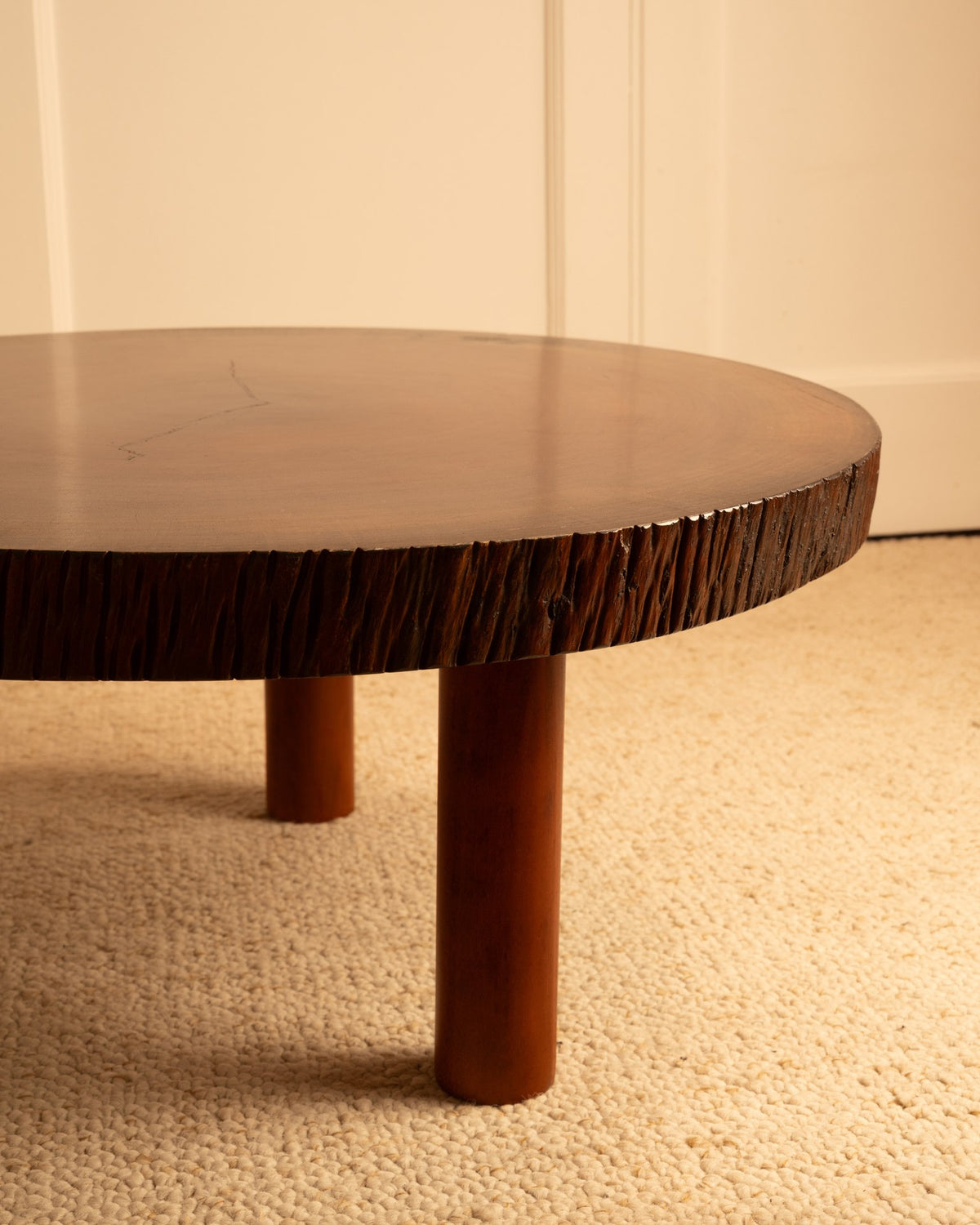 Close-up view of vintage Spanish coffee table edge and legs