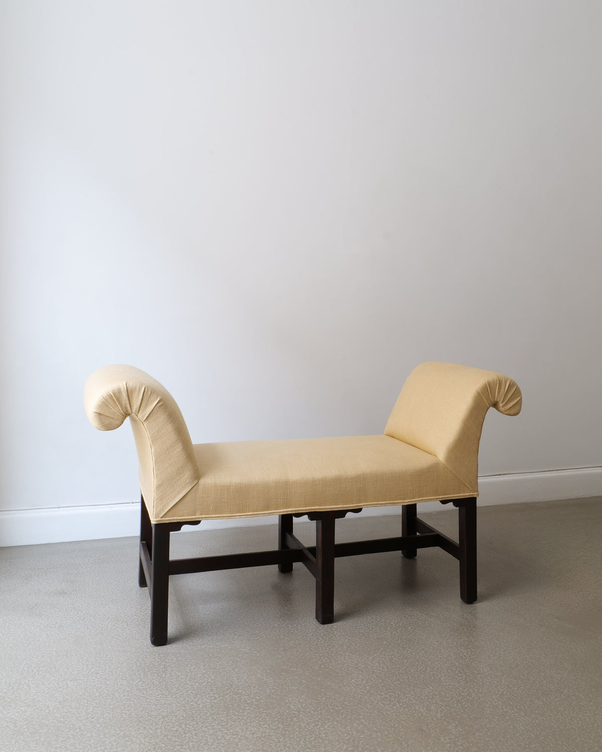Swedish window seat bench 1900s, cream upholstery, dark wood base, three-quarter view