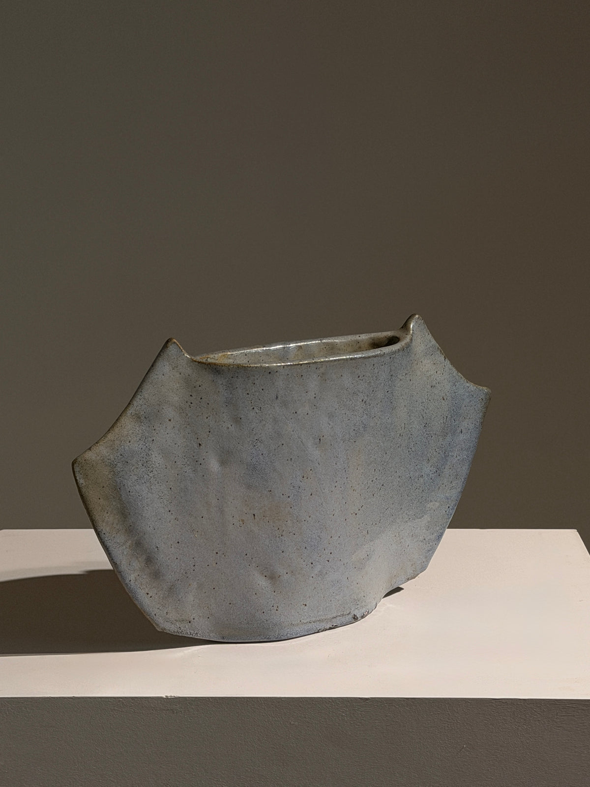 Free-form vase in blue-grey glazed ceramic, France, circa 1970.  — side angle