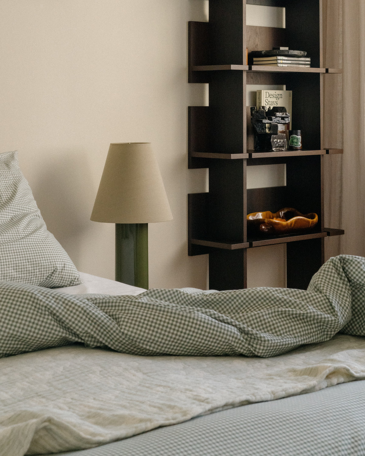 Giro" Table Lamp - Treetop & Beige — side angle on bedside table