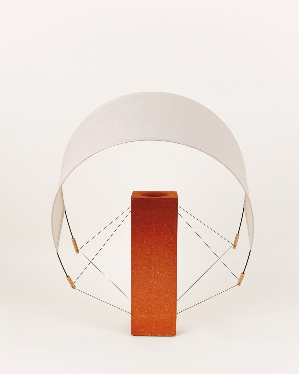 Lumia terracotta table lamp with geometric acrylic shade details