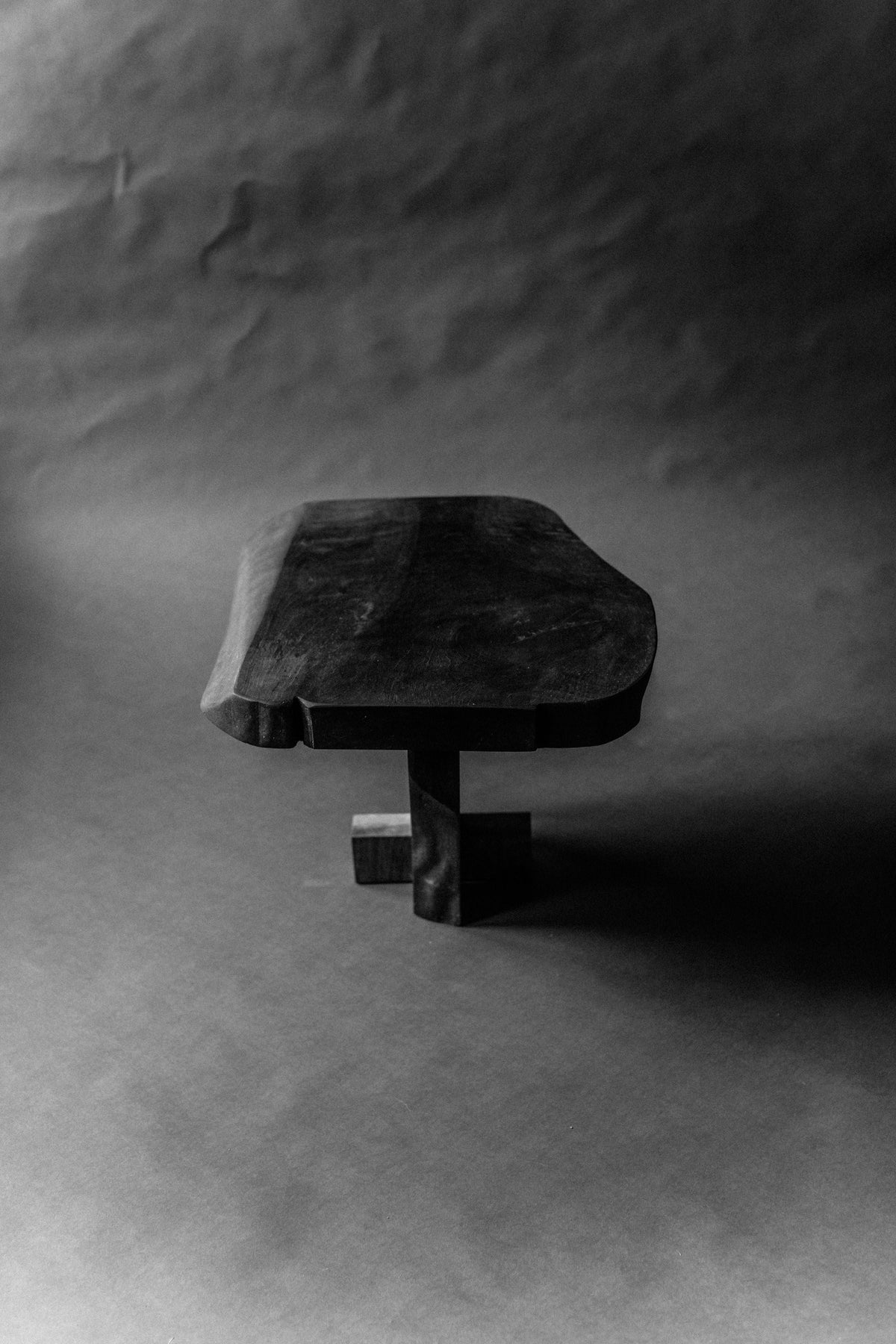 Black marble Qawha side table with geometric base detail
