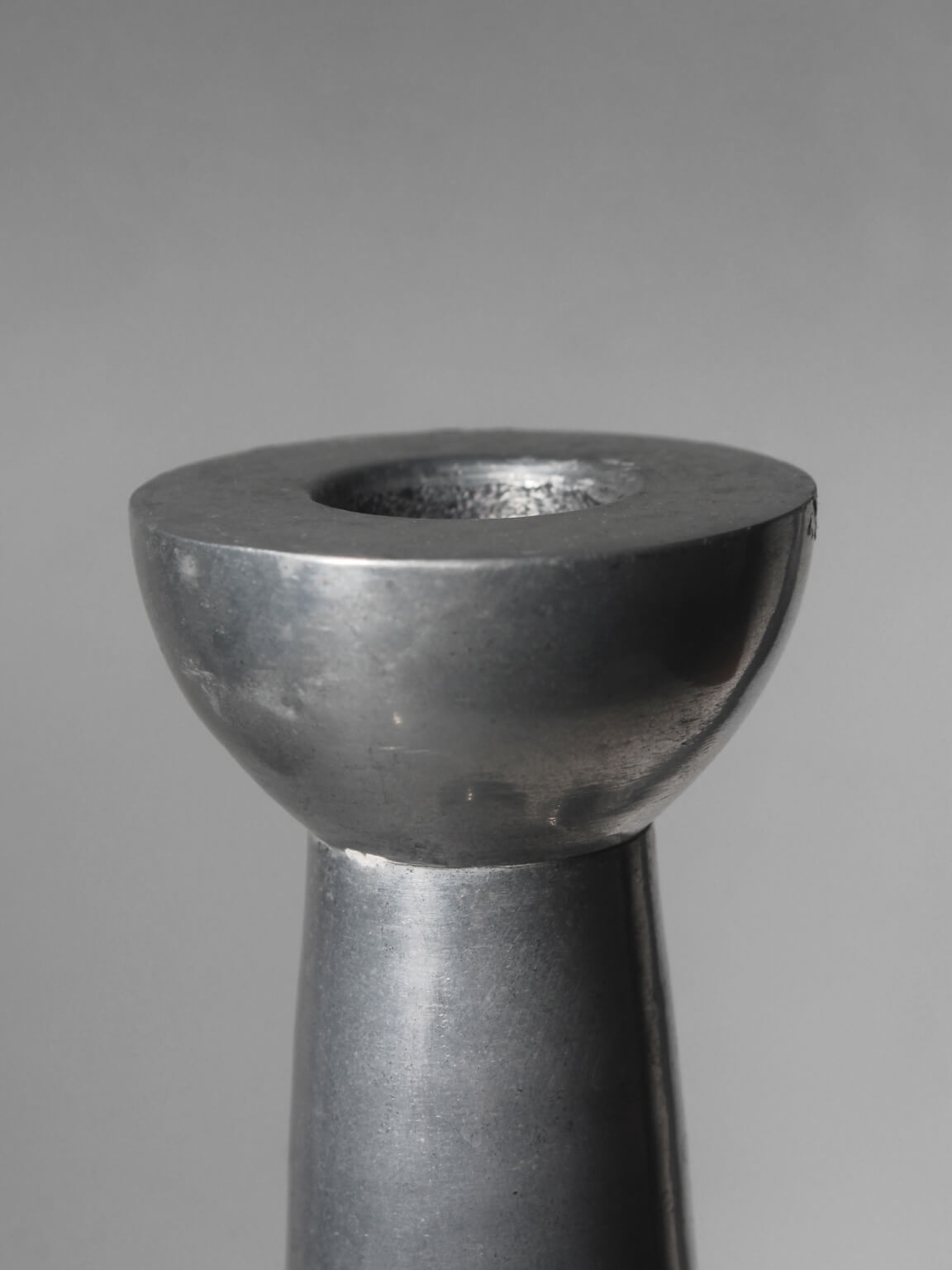 Pair Of Massive Rimmed Aluminum Candle Holders — lifestyle setting