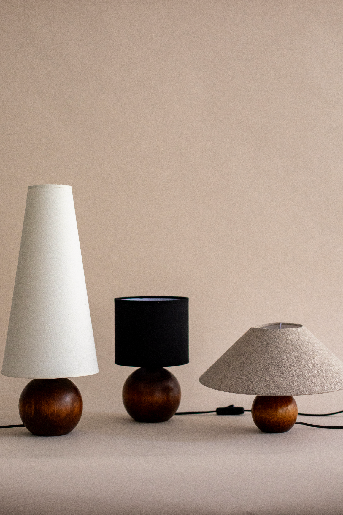 Three Pico table lamps with wooden bases and different shade styles