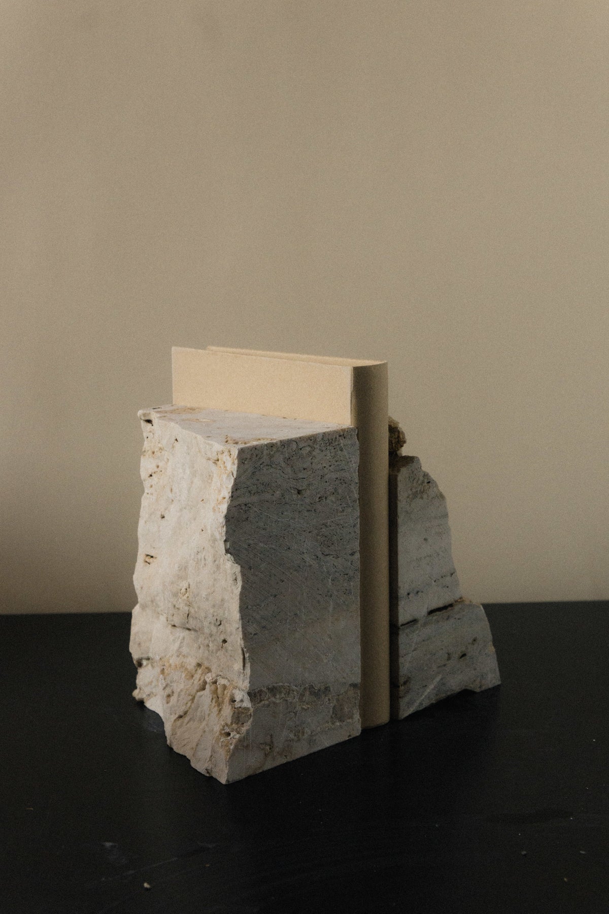 The Fragma Bookend IV - Handmade Travertine Marble Bookend — lifestyle setting