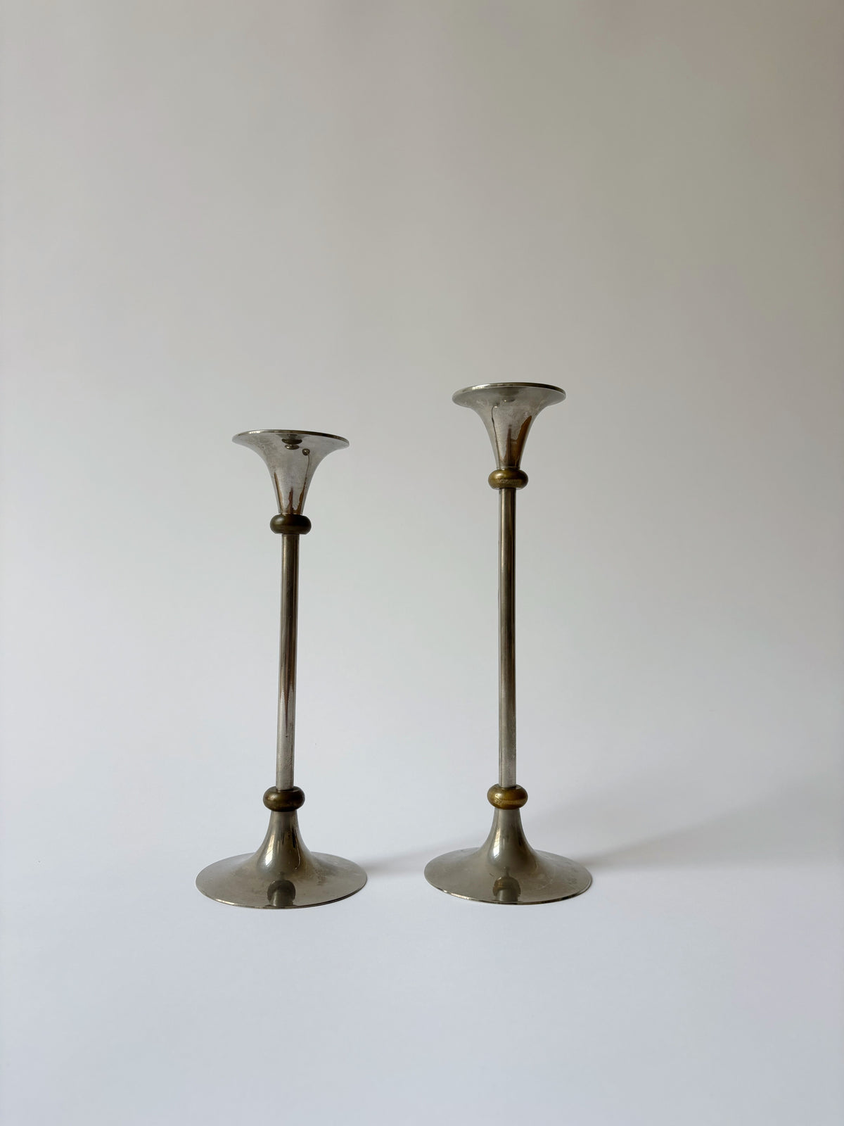 2 Metal Postmodern Candleholders — side angle showing metallic finish and design