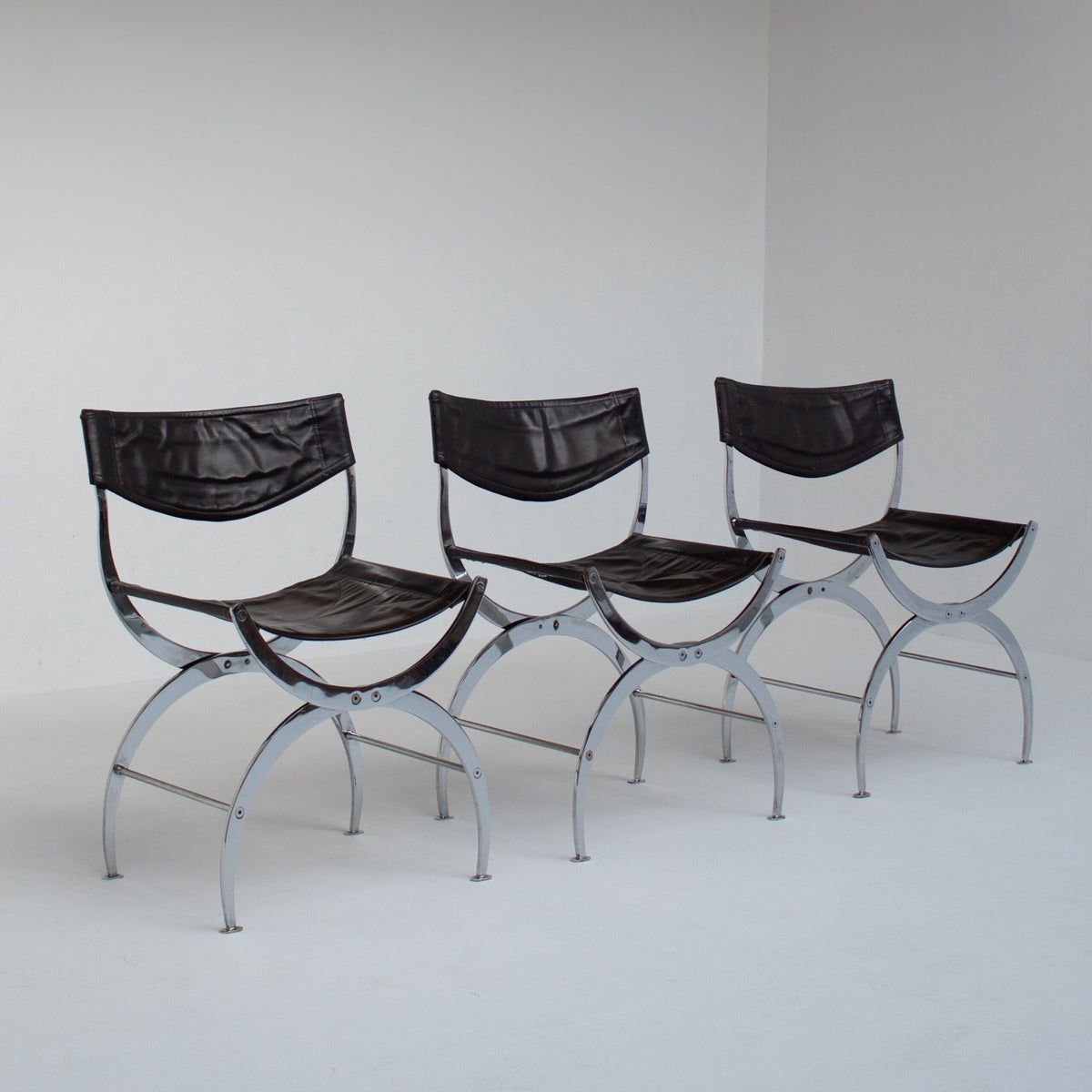 Set of 6 Italian Chrome Dining Chairs with Leather Seating — side view against white background
