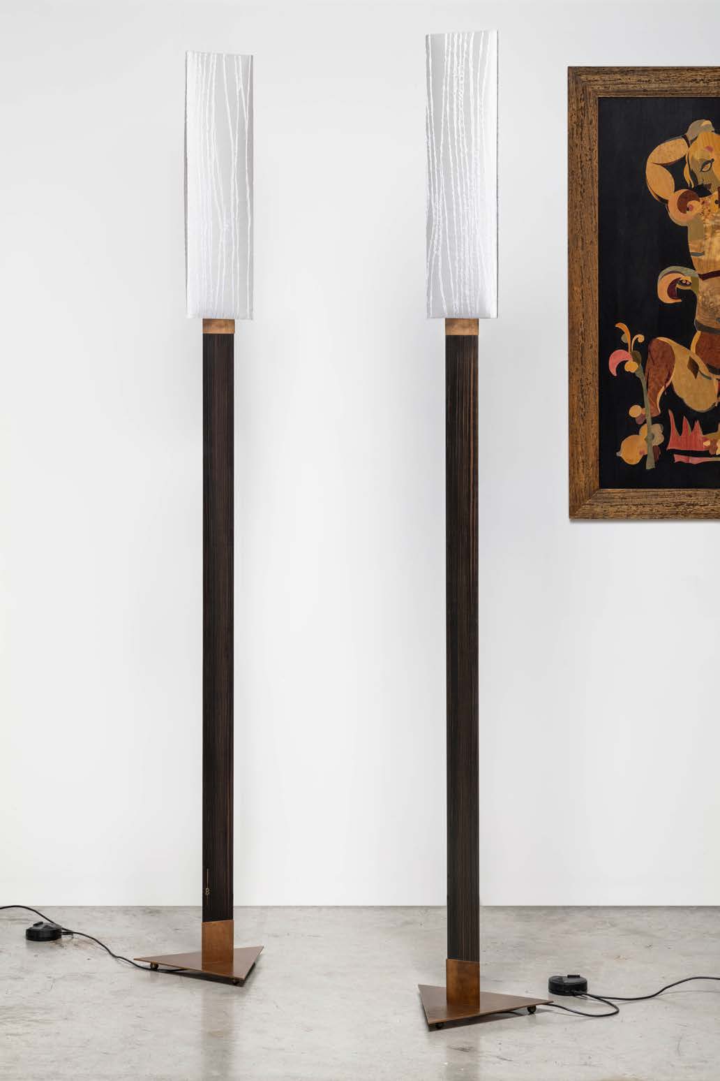 Two modern Aldebaran floor lamps with textured glass shades and dark wood stems