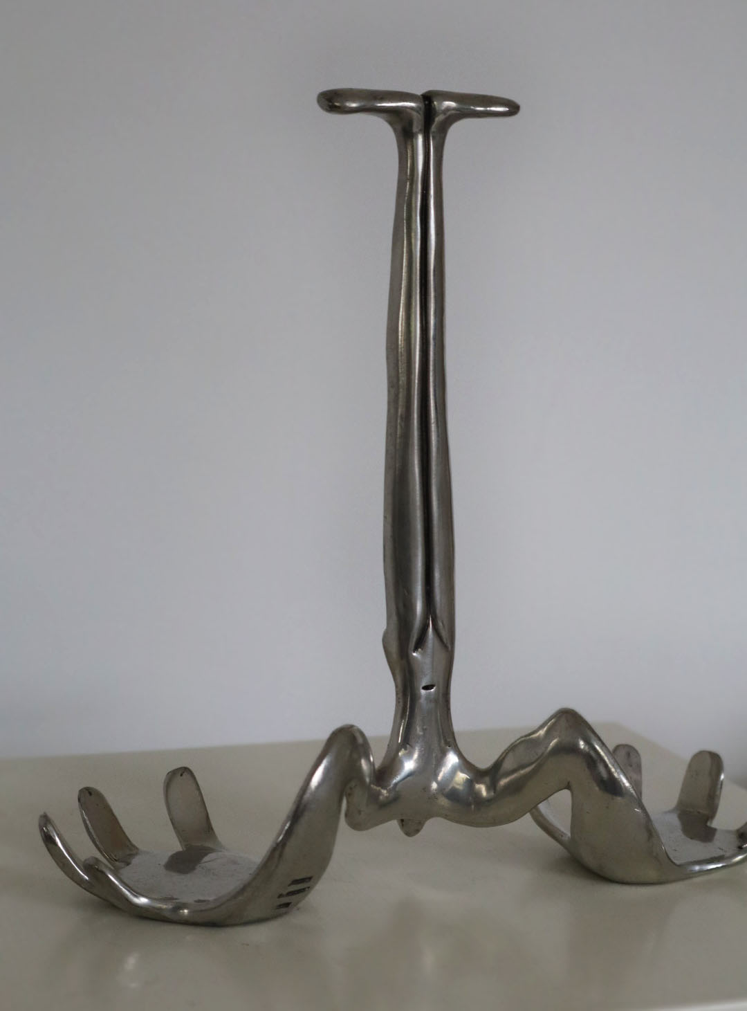 Carrol Boyes Sculptural Bottle Holder in Polished Metal — side angle