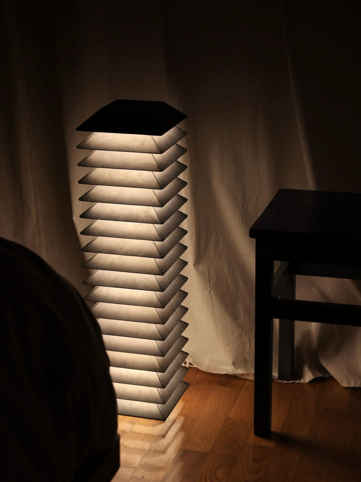 Pagoda Floor Lamp — side angle with soft light in dark room