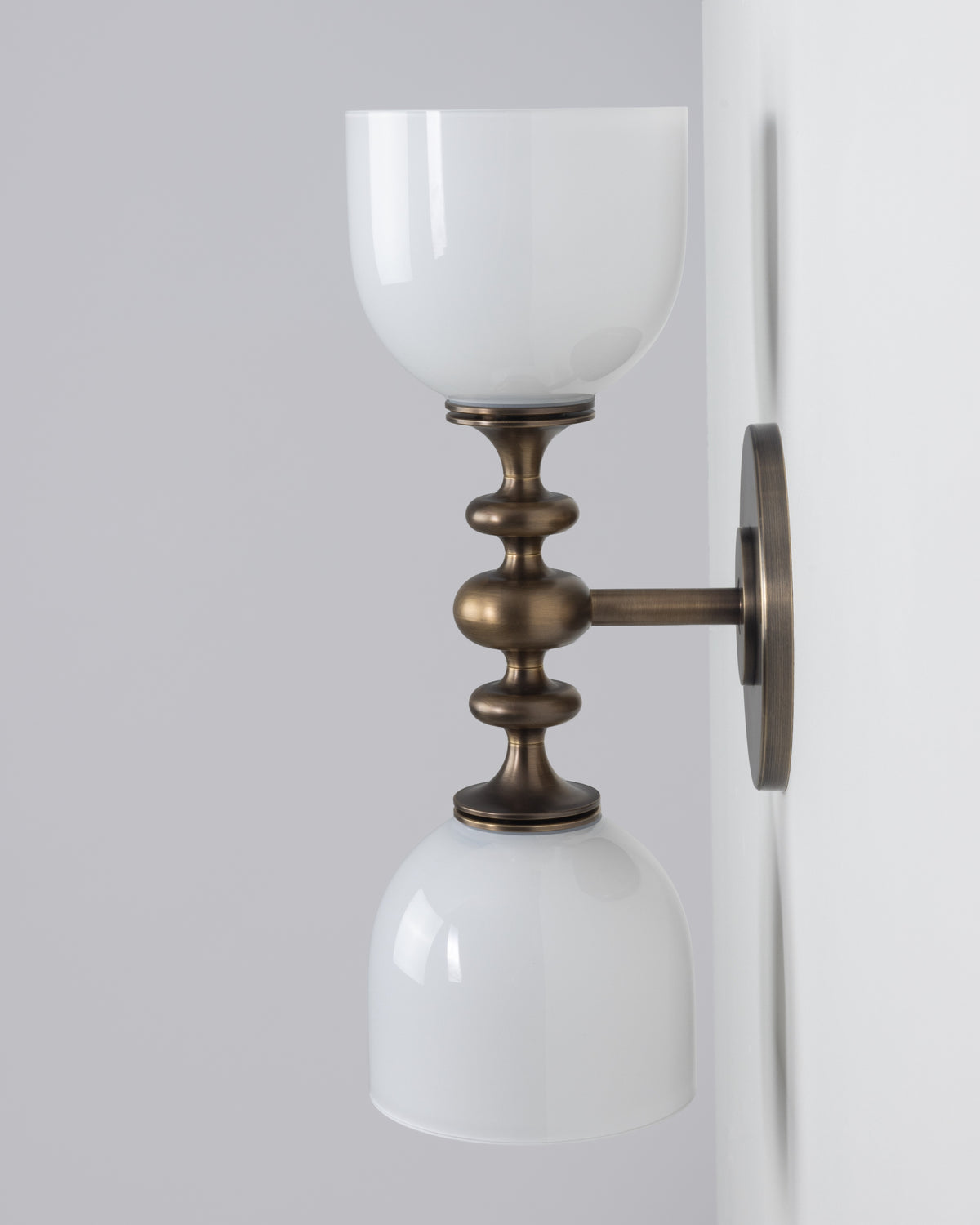 SkLO + AvroKO Marchesa Sconce - White glass, Antique Brass finish — side angle