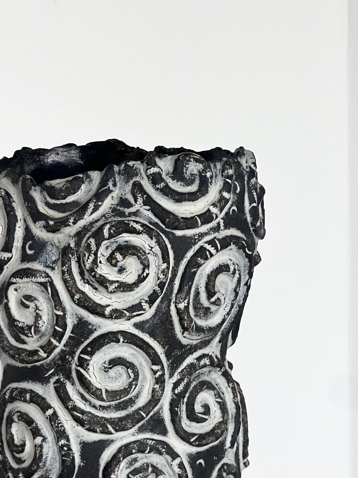Close-up spiral relief detail on handcrafted ceramic vase