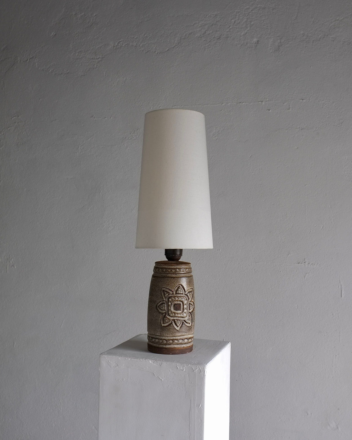 Mid-century stoneware table lamp with carved floral motif by Irma Yourstone
