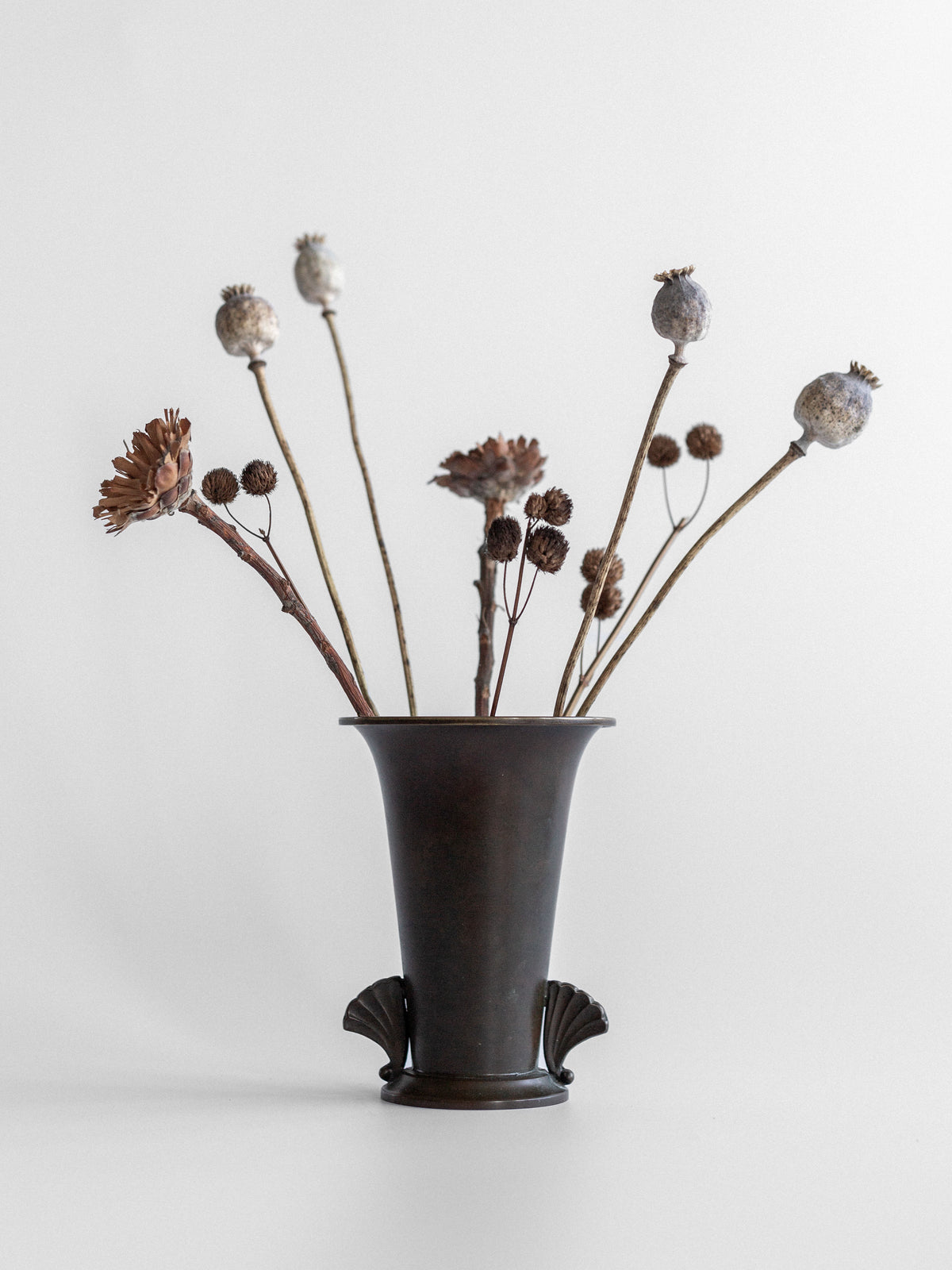 Danish Art Deco bronze vase with dried botanical arrangement