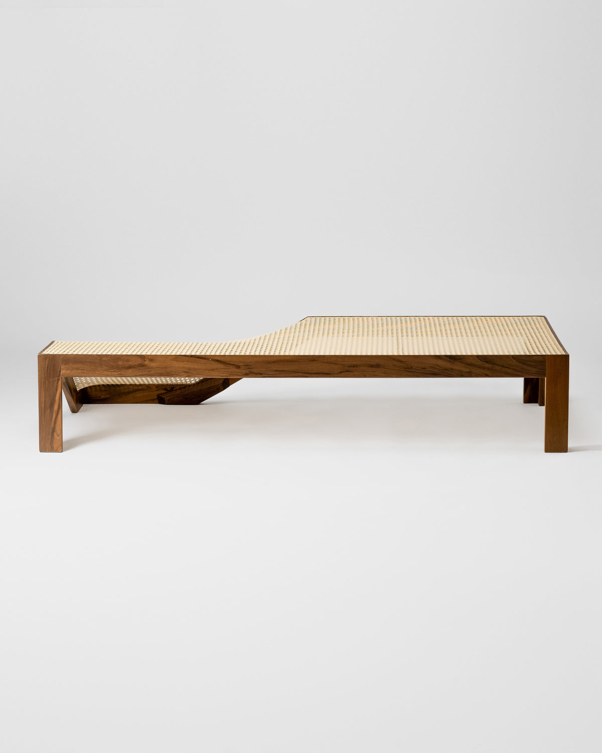 Modern wooden center table with woven cane top and lower shelf