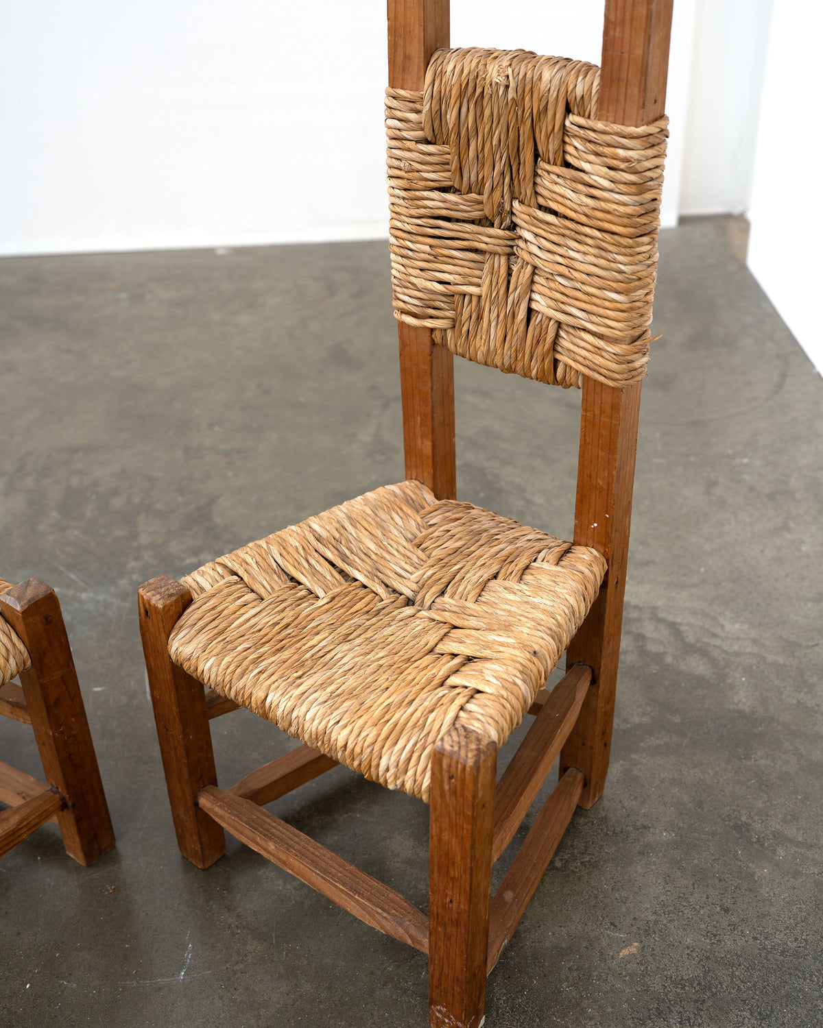 Woven rush seat and backrest detail of Chilean pine chair