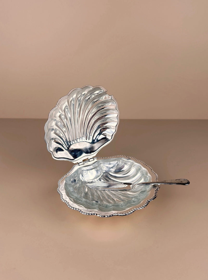 Shell-shaped silver plated butter dish with intricate floral design