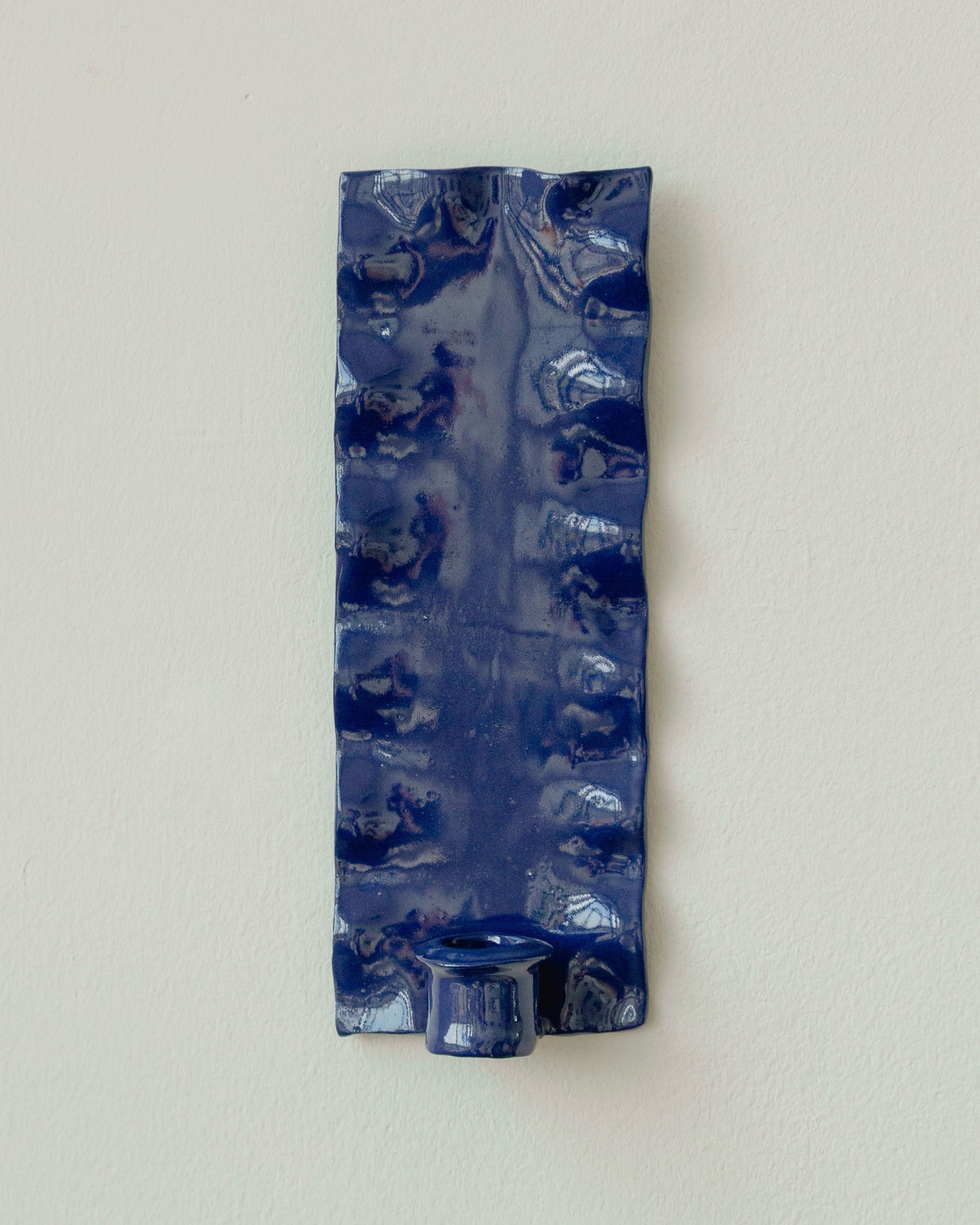Blue ceramic rectangular wall sconce with marbled glaze pattern