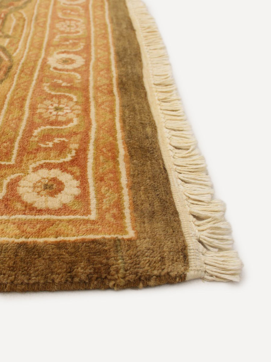 Corner detail of Chobi rug showing fringe and intricate border pattern