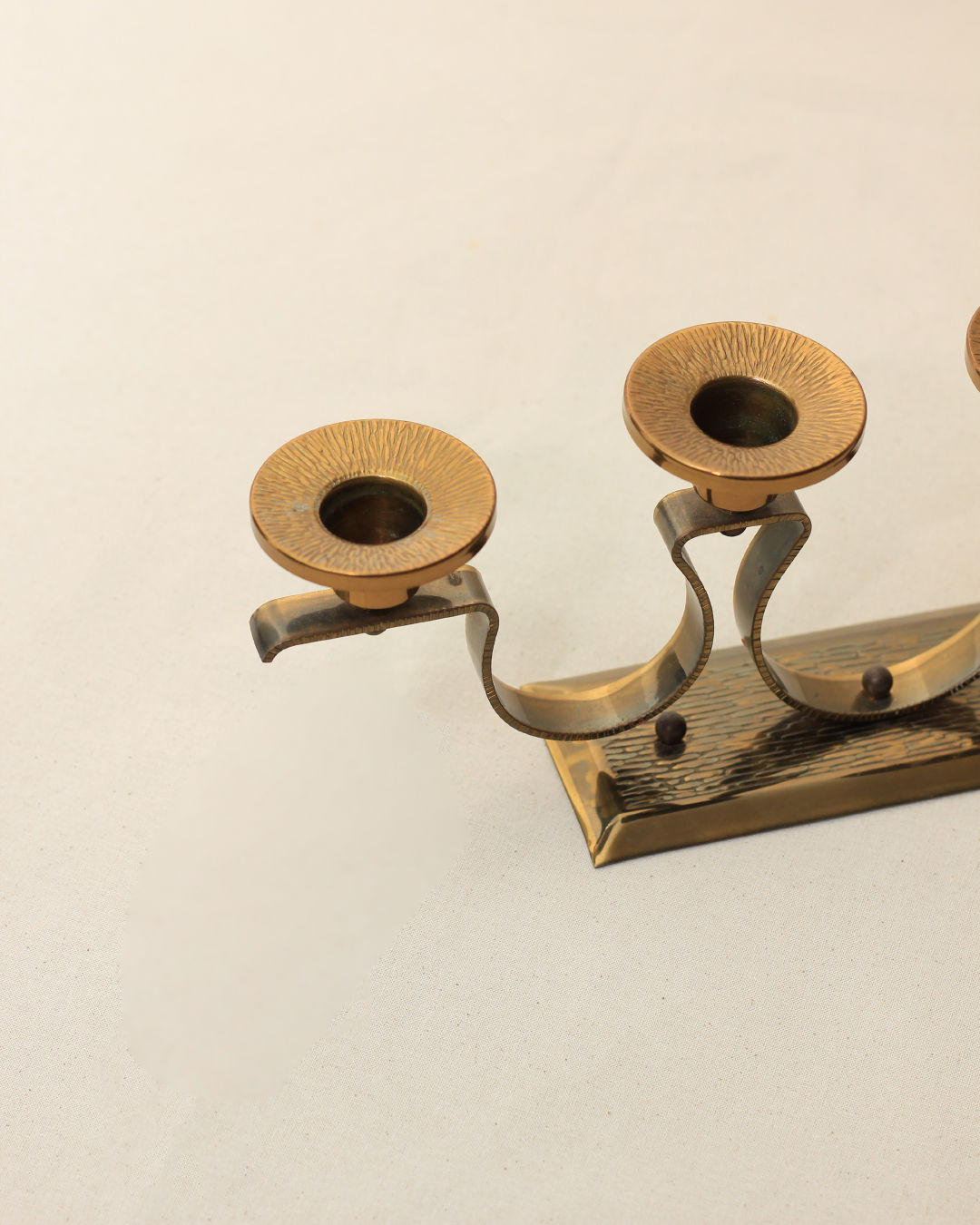 Vintage brass double candleholder with curved arms from the 1960s