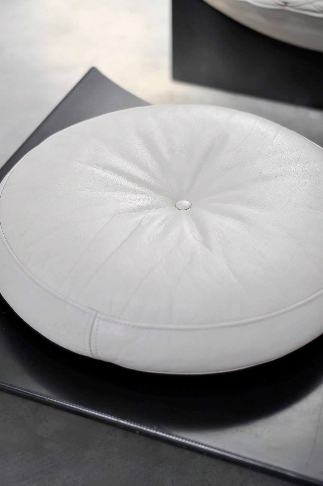 White leather upholstered seat detail of Apollo lounge chair