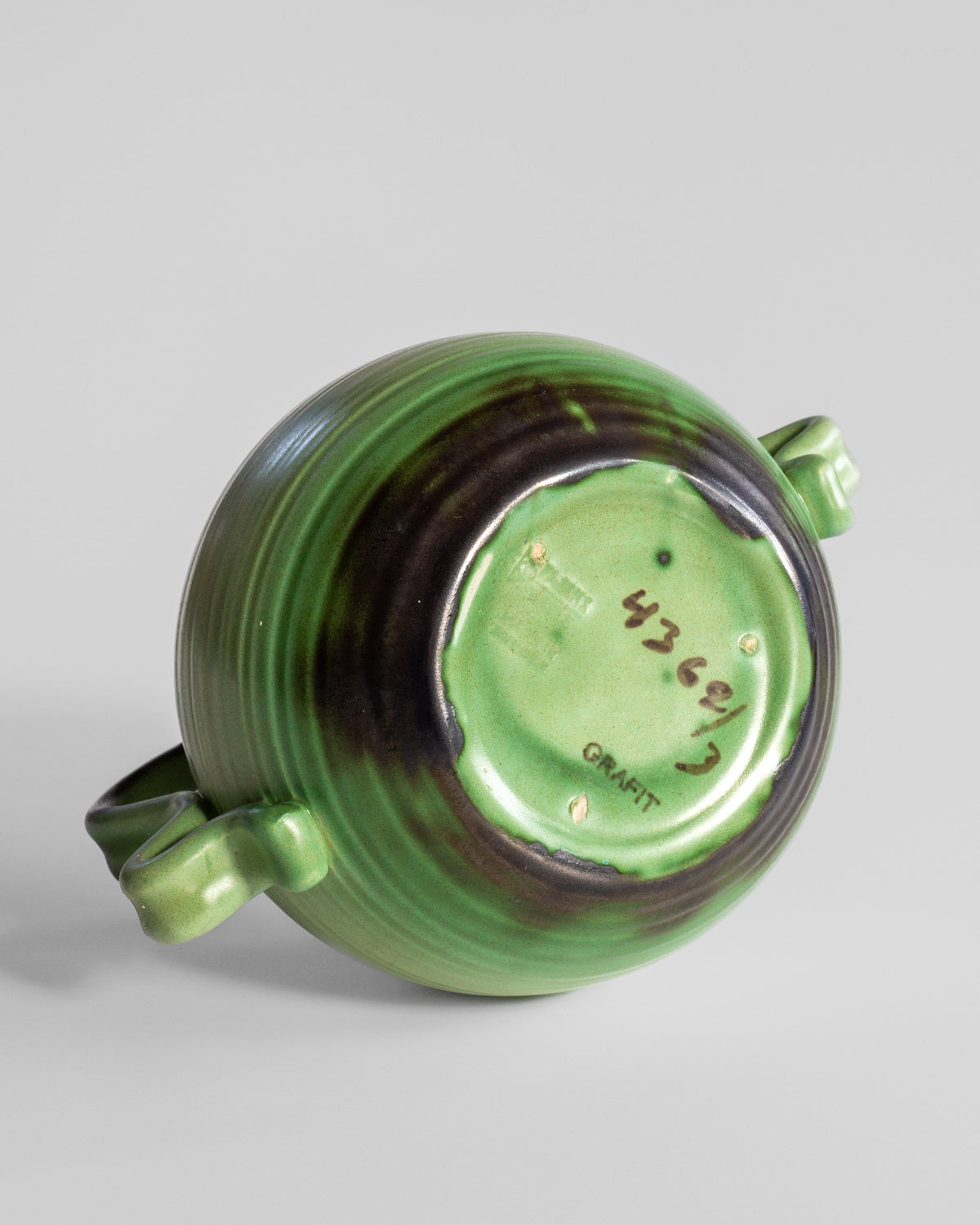 Bottom view of green Grafit ceramic vase showing maker's mark