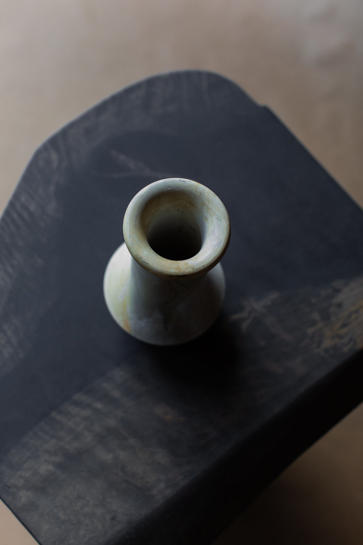 Vintage stone vase opening detail showing weathered rim texture