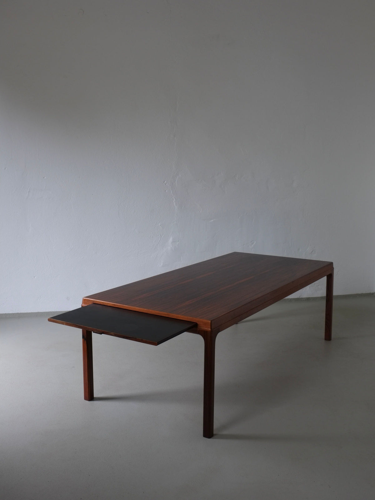 Johannes Andersen rosewood coffee table with extended black shelf