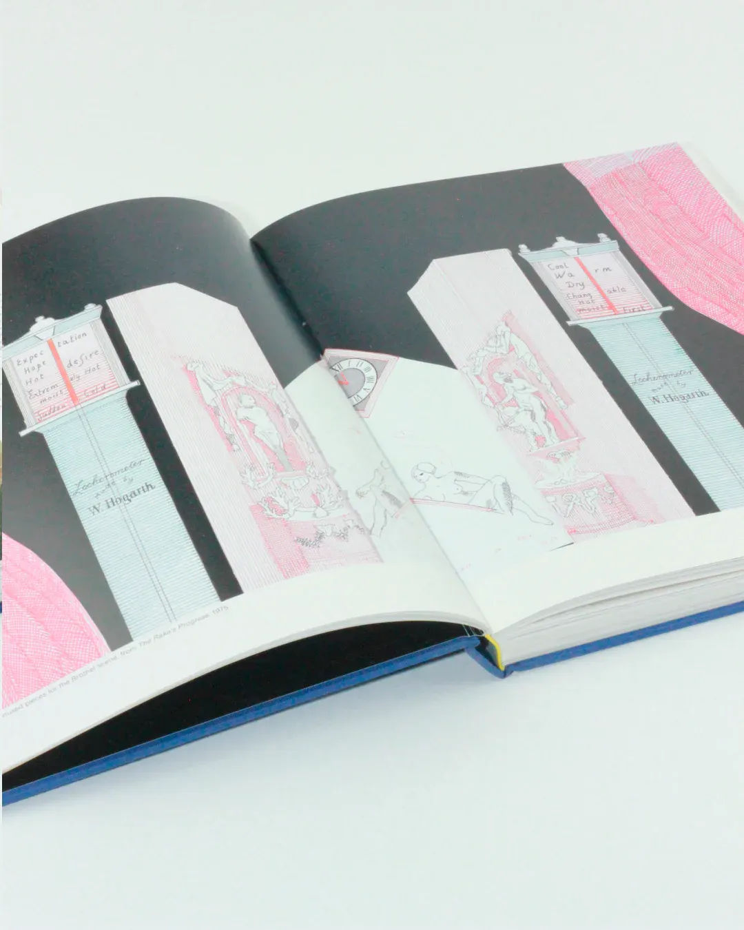 An open copy of "That's the way I see it: David Hockney" lies on display, showing a page with an illustration of a church interior that has a contemporary art feel. The predominantly red and white illustrations resemble the style of David Hockney. Text columns on both the left and right pages offer detailed descriptions. The book, available from Boga Avante Shop, features a blue cover with a yellow bookmark.