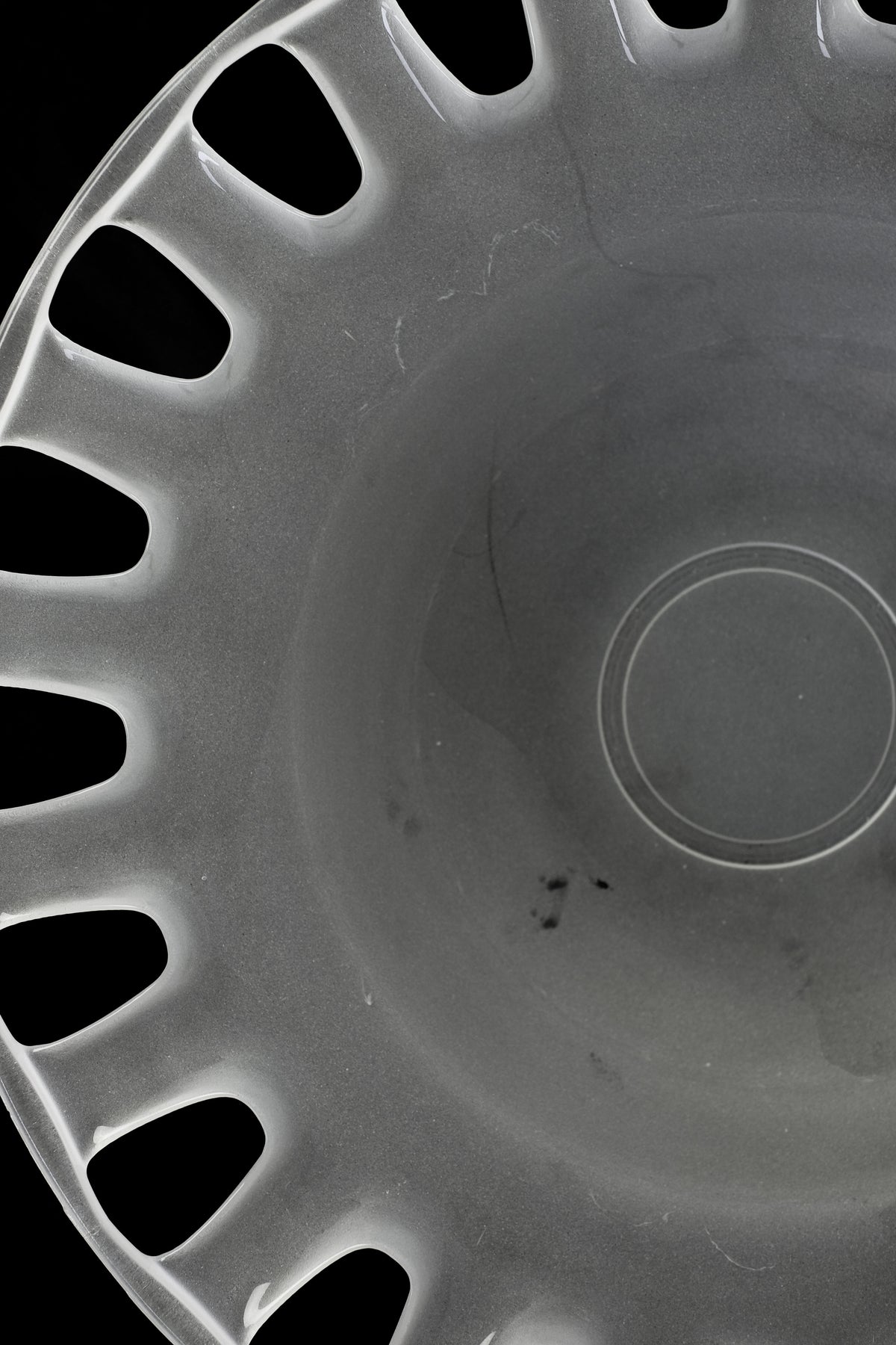 Close-up detail of milk glass bowl showing curved rim and surface