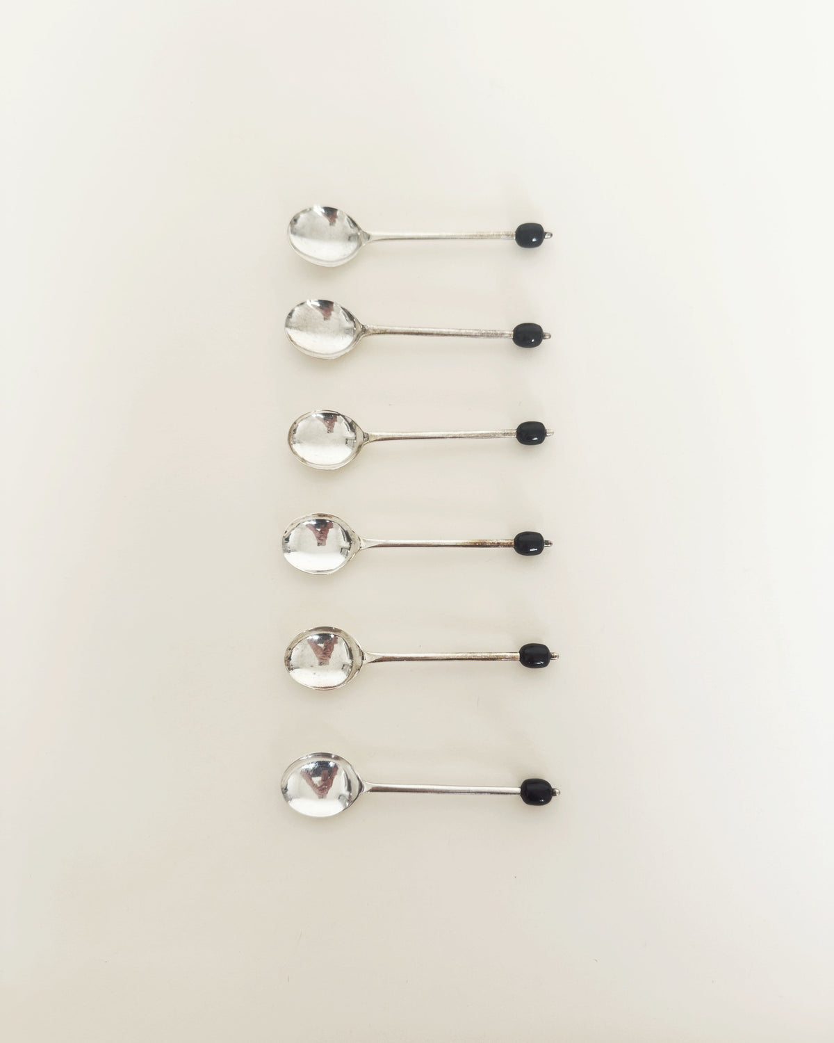 Set of six silver vintage coffee bean spoons with black bead handles