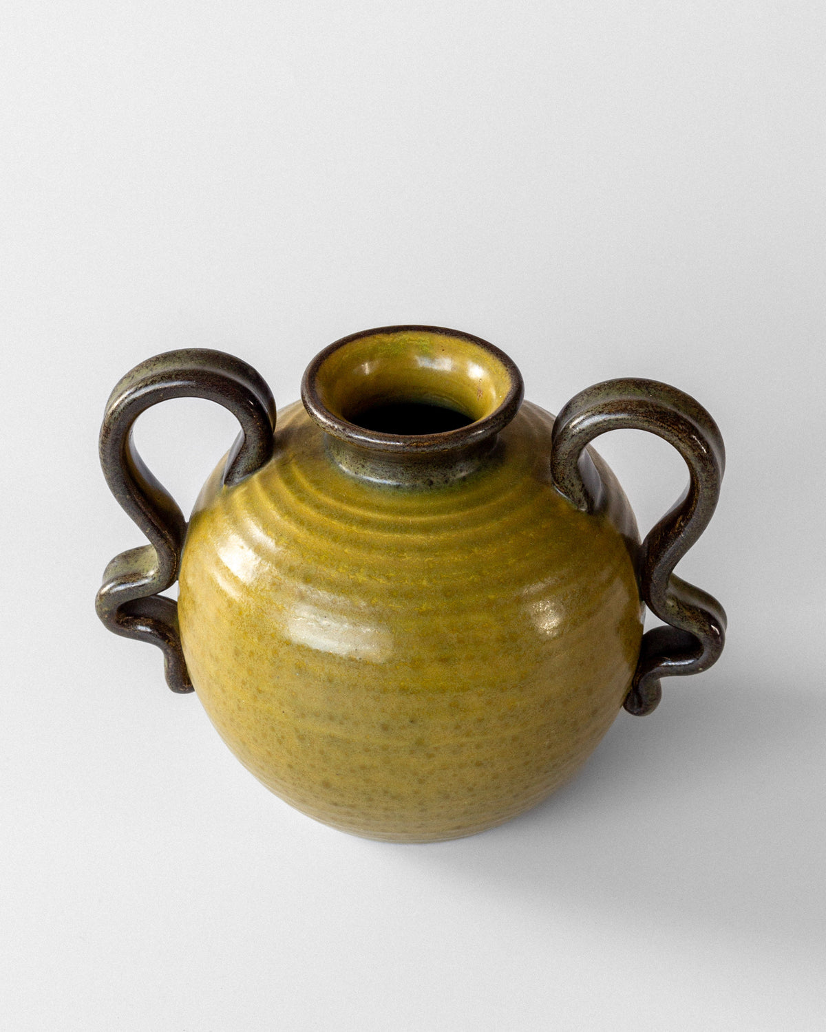 Round olive green ceramic vase with four curved handles by Eva Jancke-Bjork