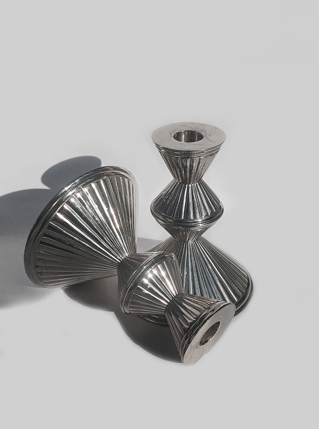 Pair of elegant metal candle holders with a sleek and modern design