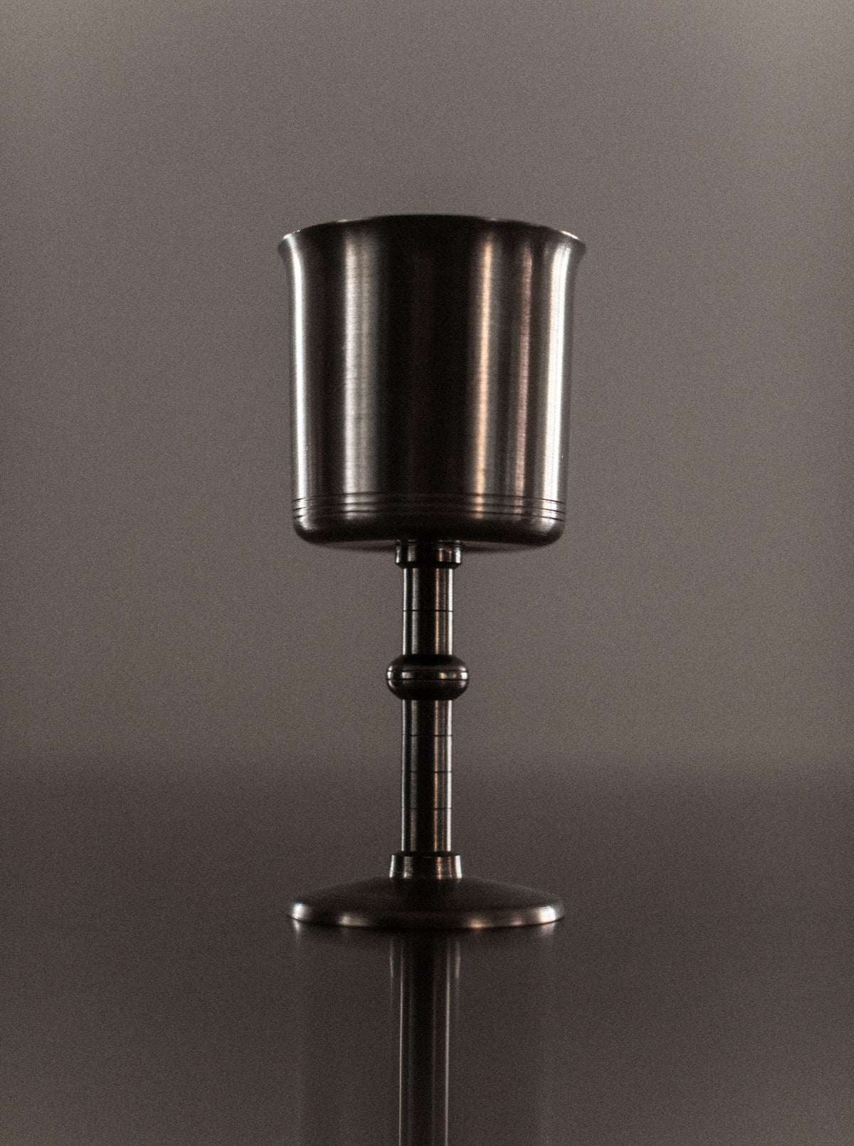 Set of four black and gold Art Deco style ceramic cups with intricate geometric patterns