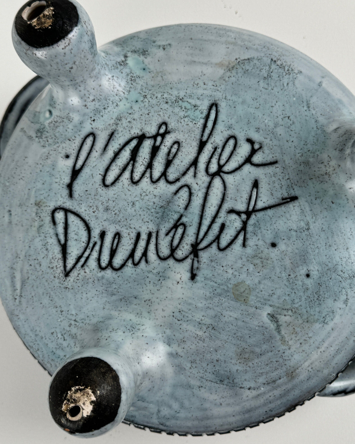 Close-up view of ceramic tureen base showing Jacques Pouchain signature