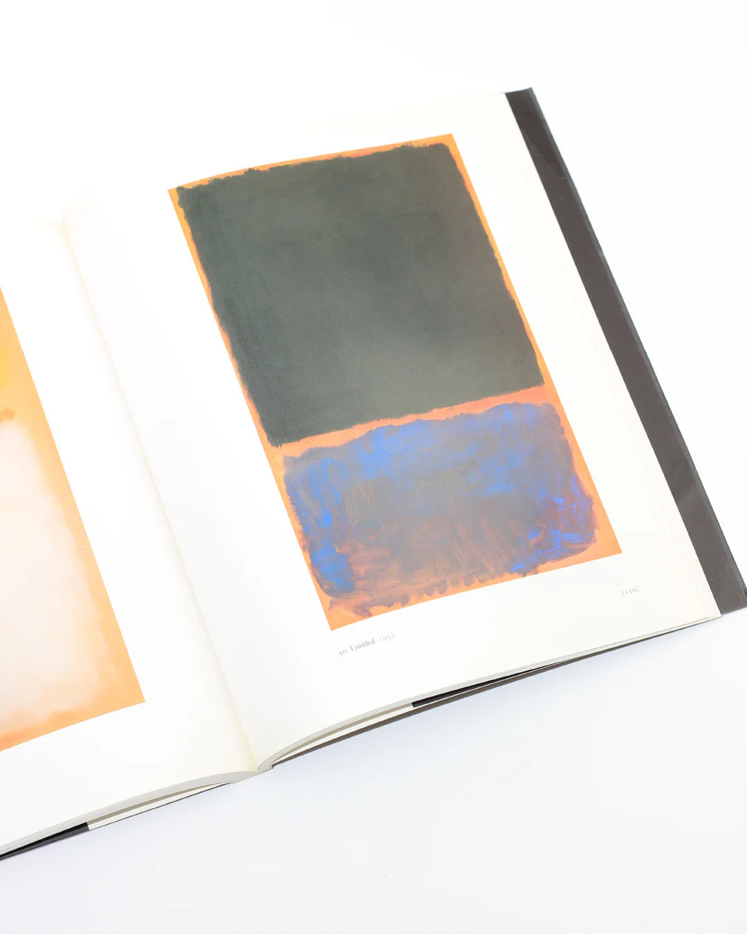 Open Mark Rothko art book showing abstract color field painting
