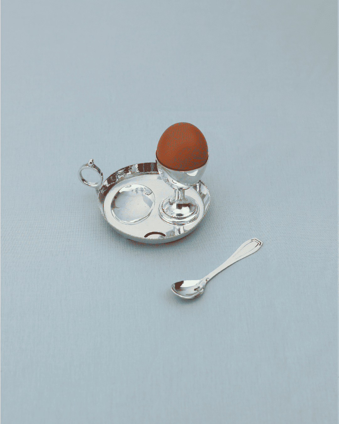 Silver egg cup with tray and spoon serveware set detail view