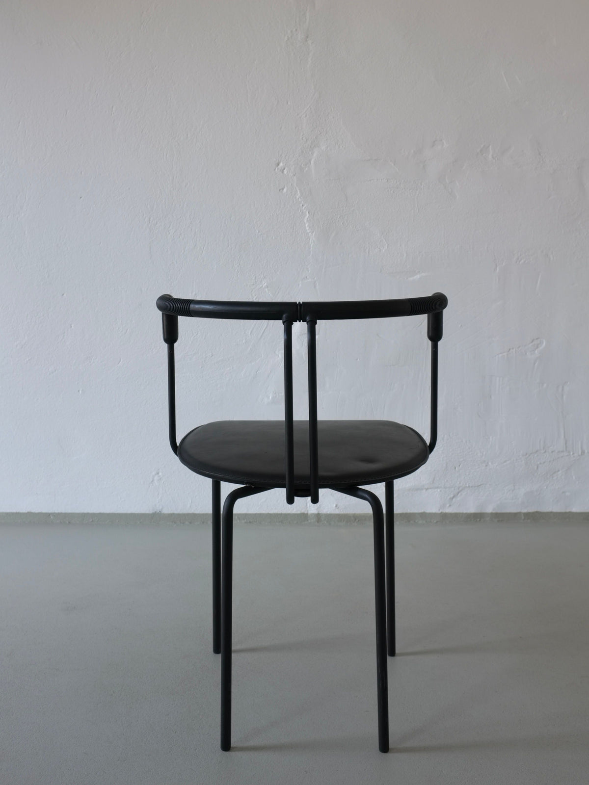 Black leather Cidue postmodern armchair front view Italy 1990s
