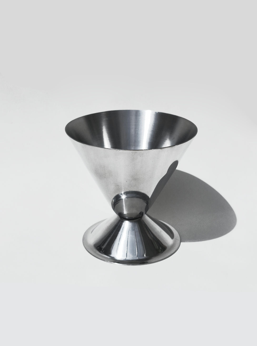 Polished steel conic cup detail showing conical bowl design