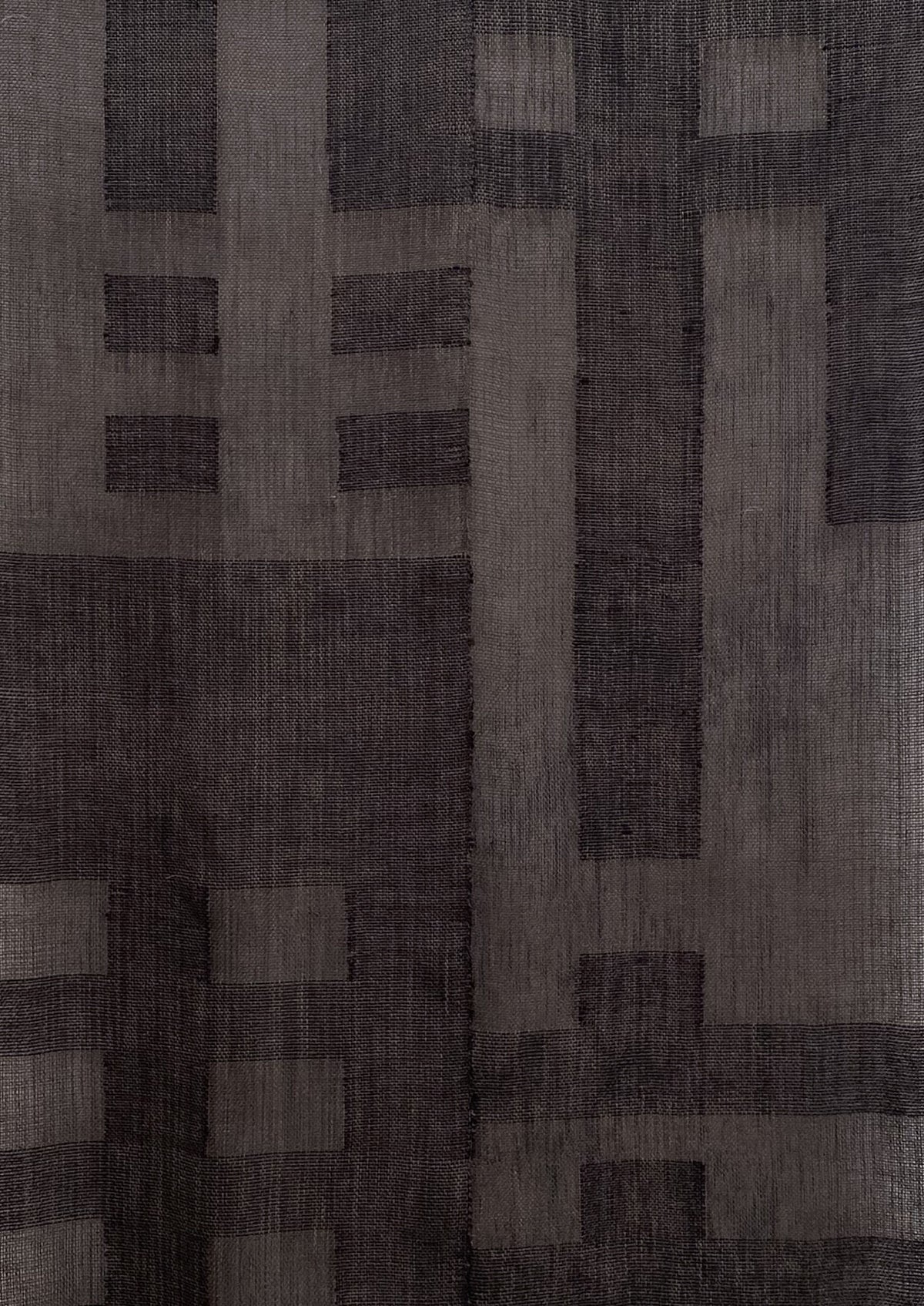 Grid I by Sundance Studio is a dark abstract design inspired by the Bauhaus movement, showcasing large interlocking rectangles and squares in various shades of gray and black with a geometric pattern that resembles a woven texture, adding depth to its composition.
