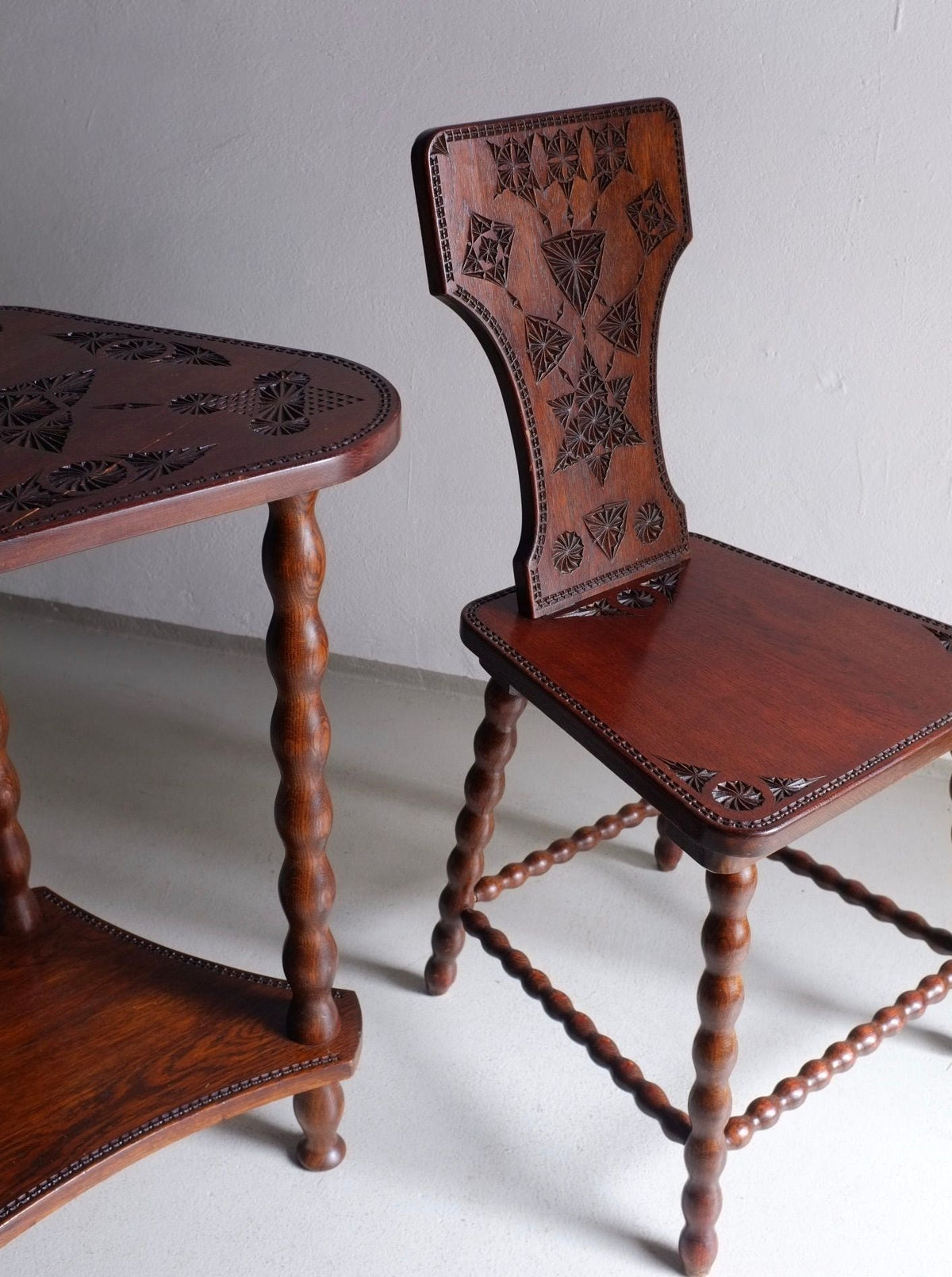 Matching chair and table set made from carved wood