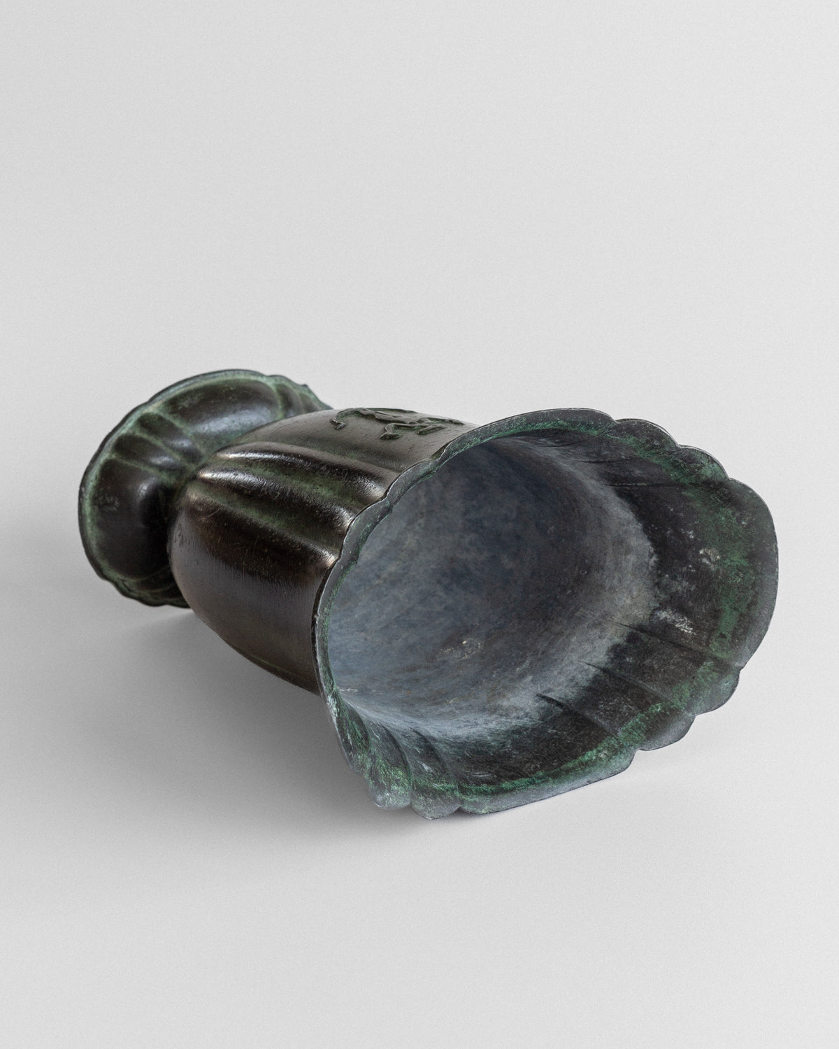 Cast iron Art Deco vase interior view showing patina finish