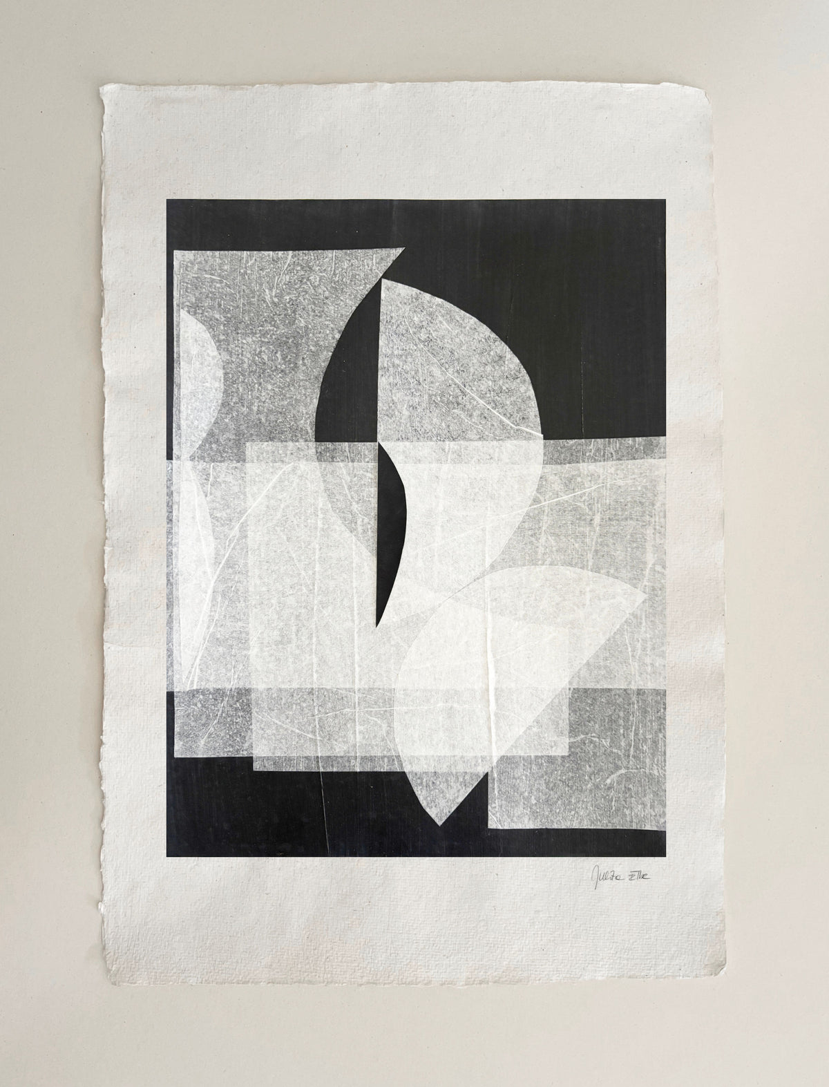 Abstract geometric mixed media artwork with black and gray circular forms