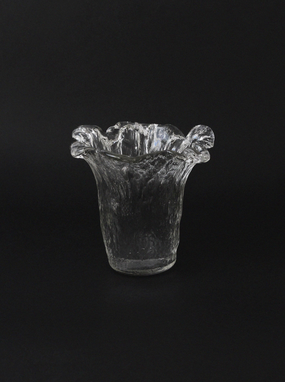 The Uno Westerberg 60s Organic Glass Vase by Vintage Stories features a clear, textured ice glaze design with a wavy, ruffled rim, displayed against a plain black background.