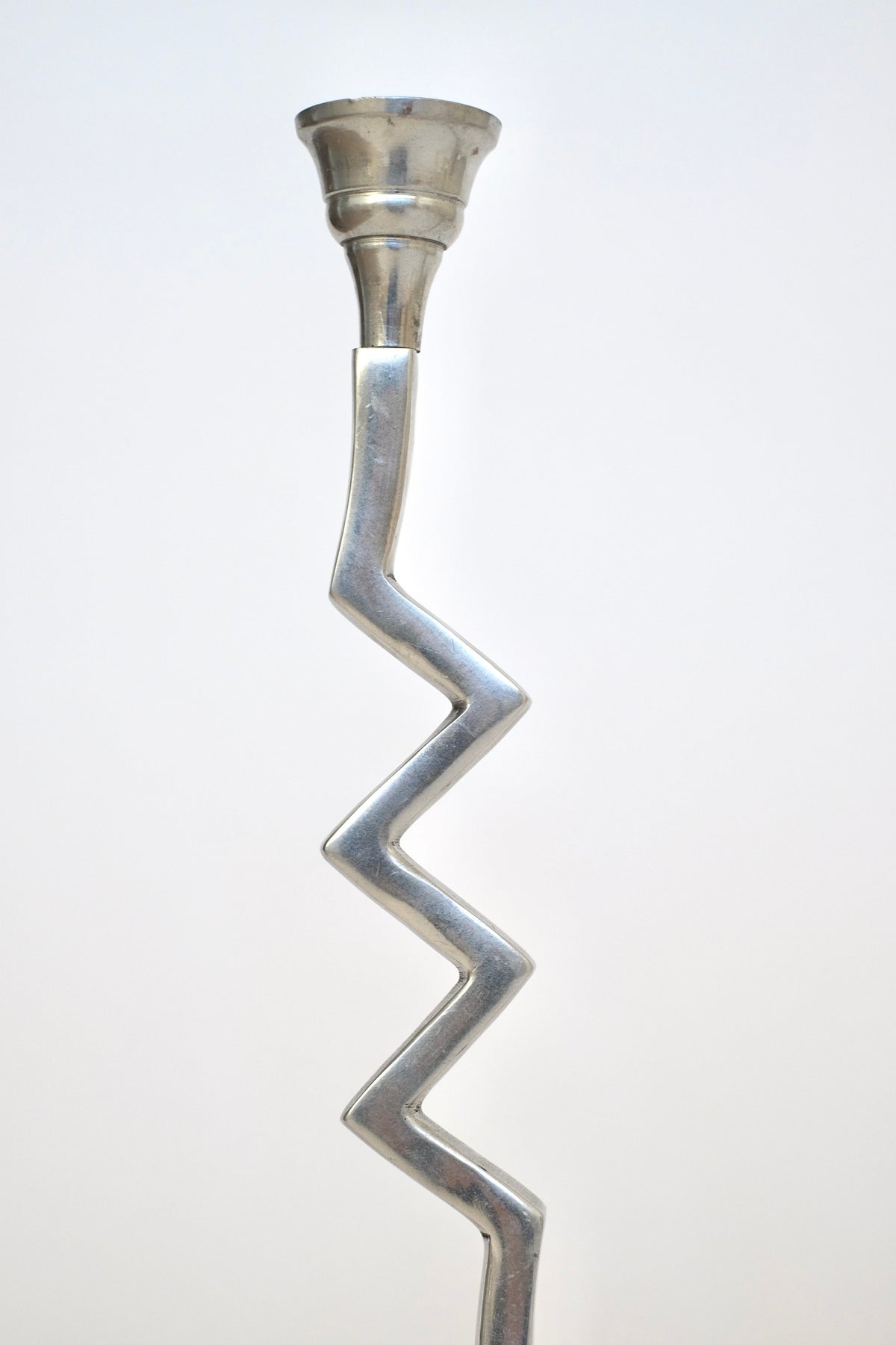 This sought-after set of zigzag candleholders from septembre studios features a sleek silver finish, showcasing the elegance and uniqueness that define premium candle holders.